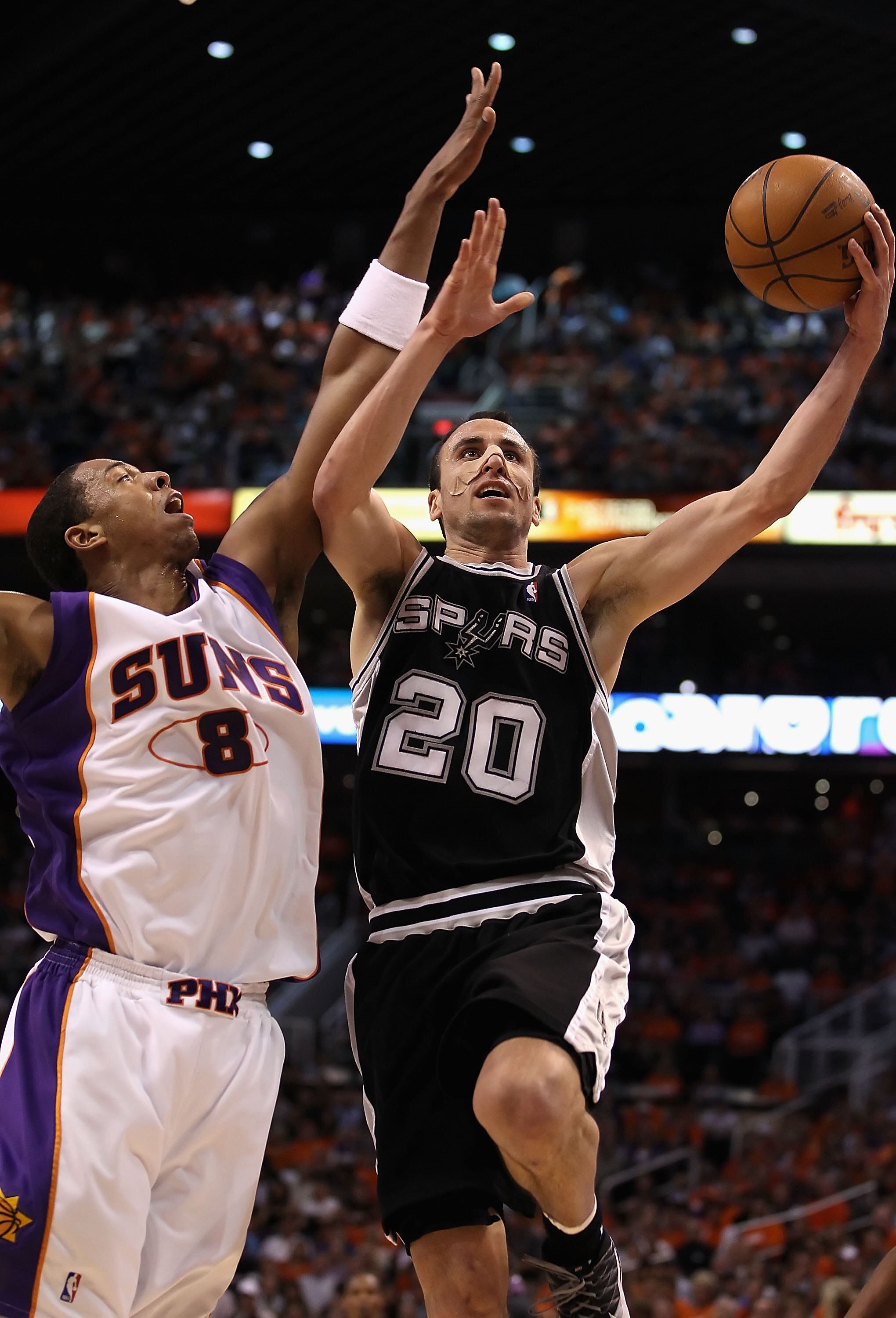 PHOENIX - MAY 03:  Manu Ginobili #20 of the San Antonio Spurs lays up a shot during Game One of the Western Conference Semifinals of the 2010 NBA Playoffs against the Phoenix Suns at US Airways Center on May 3, 2010 in Phoenix, Arizona.  The Suns defeated