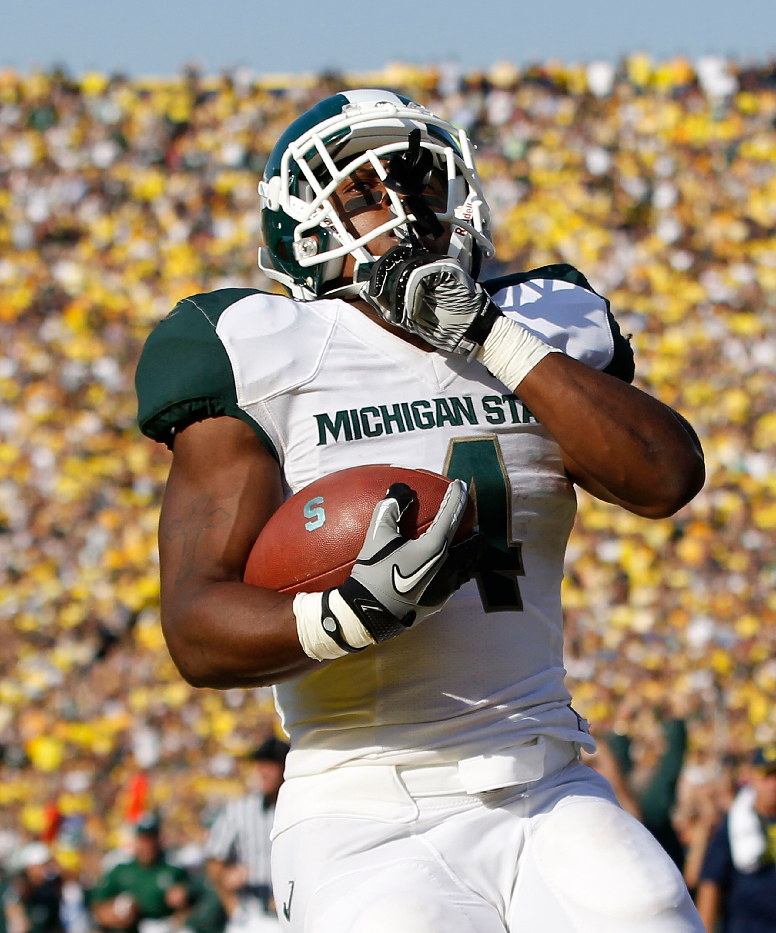 ANN ARBOR, MI - OCTOBER 09: Edwin Baker #4 of the Michigan State Spartans scores on a 61 yard touchdown in the second quarter during the game against the Michigan Wolverines during the game on October 9, 2010 at Michigan Stadium in Ann Arbor, Michigan. Th