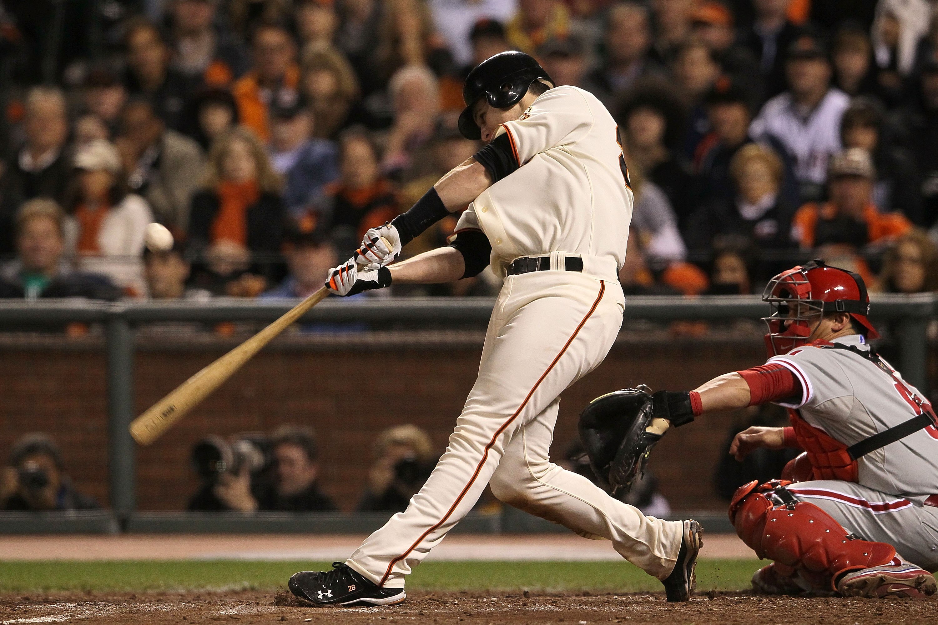 SAN FRANCISCO - OCTOBER 20:  Buster Posey #28 of the San Francisco Giants hits a double in the sixth inning against the Philadelphia Phillies in Game Four of the NLCS during the 2010 MLB Playoffs at AT&T Park on October 20, 2010 in San Francisco, Californ