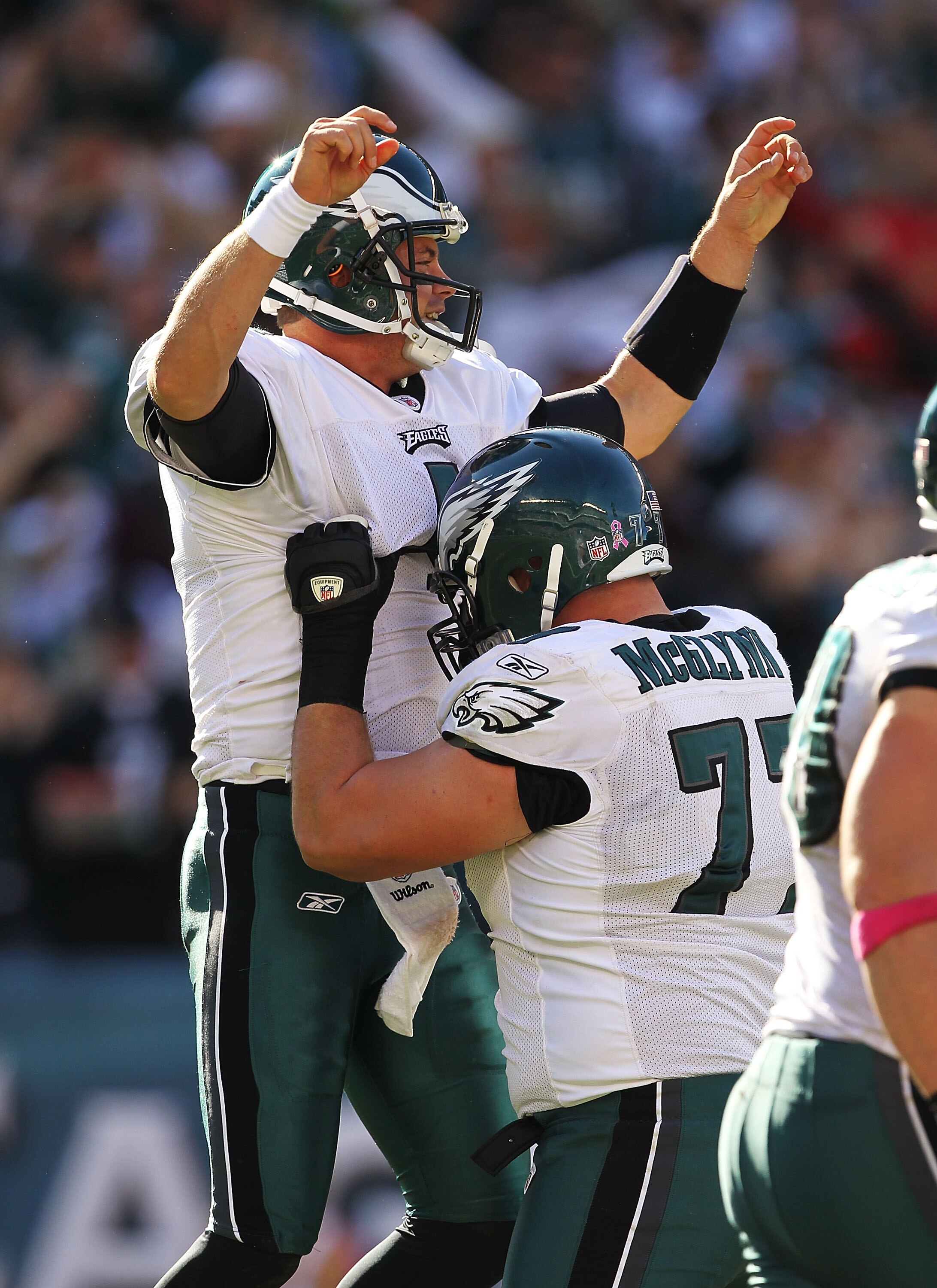 PHILADELPHIA - OCTOBER 17:  Kevin Kolb #4 of the Philadelphia Eagles celebrates with Mike McGlynn #77 after passing a touchdown to Jeremy Maclin #18 in the third quarteragainst the Atlanta Falcons during their game at Lincoln Financial Field on October 17