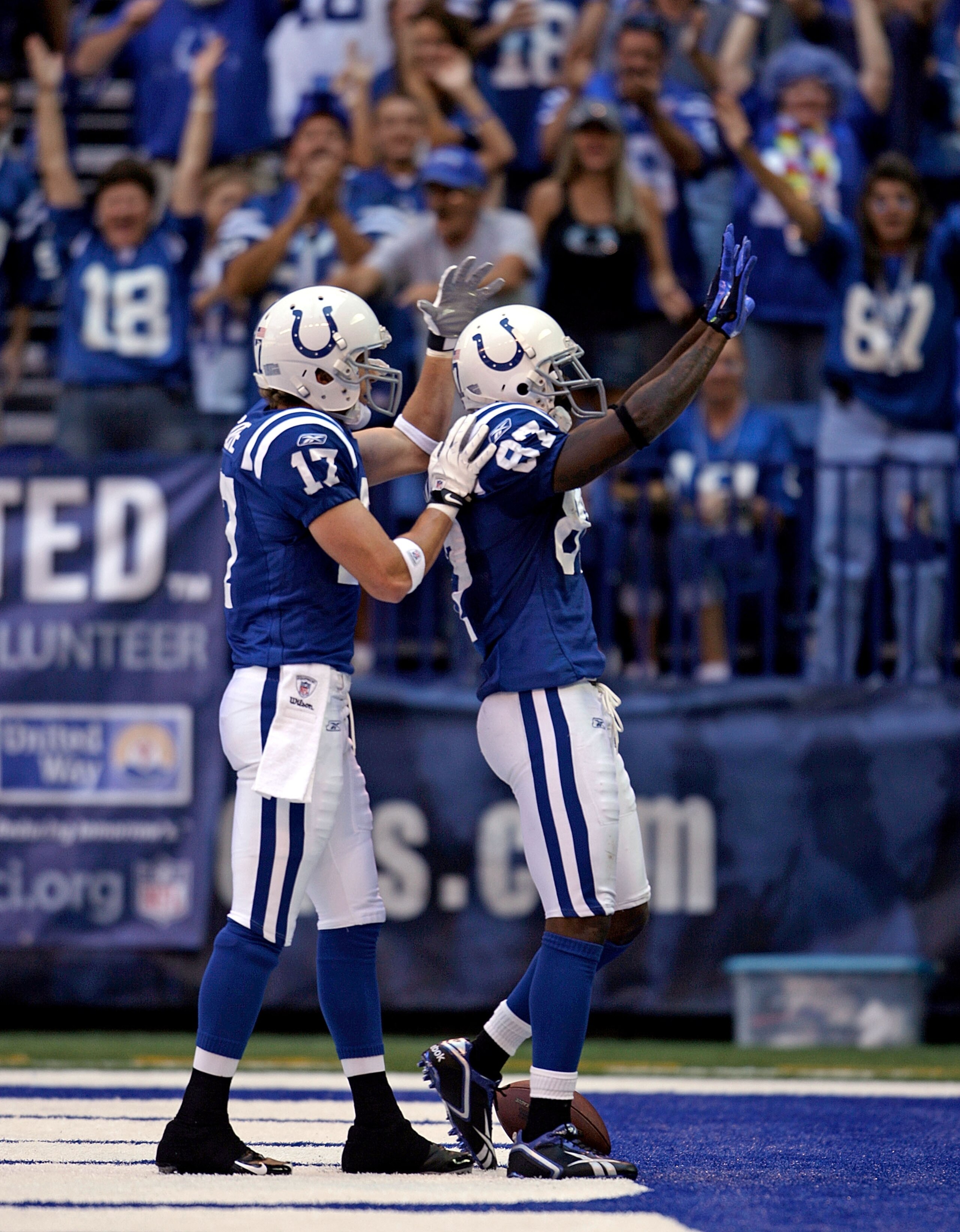 INDIANAPOLIS - SEPTEMBER 13: Reggie Wayne #87 of the Indianapolis Colts celebrates with Austin Collie #17 after Wayne scored a touchdown during the game against the Jacksonville Jaguars at Lucas Oil Stadium on September 13, 2009 in Indianapolis, Indiana. INDIANAPOLIS - SEPTEMBER 13: Reggie Wayne #87 of the Indianapolis Colts celebrates with Austin Collie #17 after Wayne scored a touchdown during the game against the Jacksonville Jaguars at Lucas Oil Stadium on September 13, 2009 in Indianapolis, Indiana.