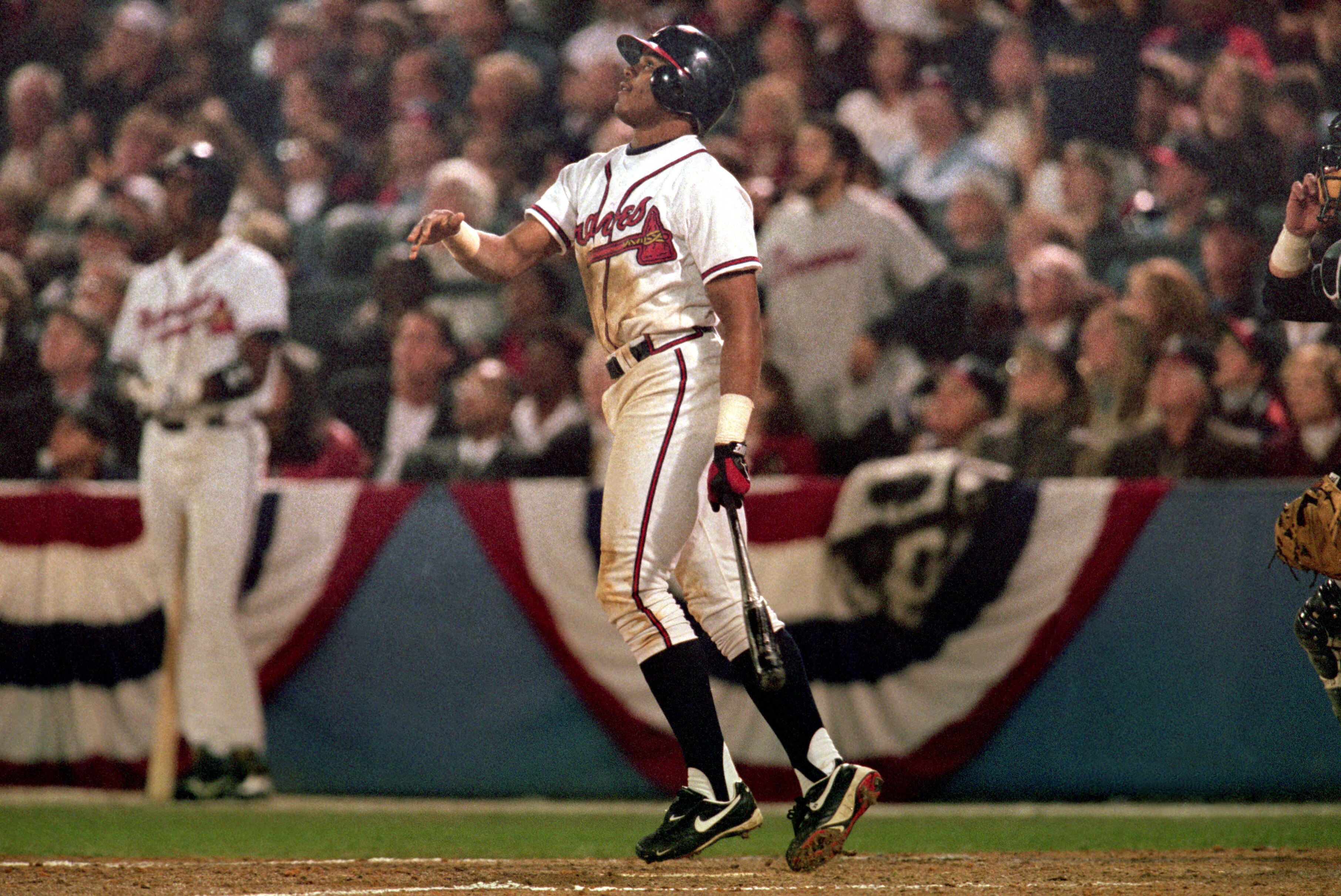 ATLANTA - OCTOBER 24:  Andruw Jones #25 of the Atlanta Braves watches the flight of the ball during Game five of the 1996 World Series against the New York Yankees at Atlanta-Fulton County Stadium on October 24, 1996 in Atlanta, Georgia. The Yankees defea