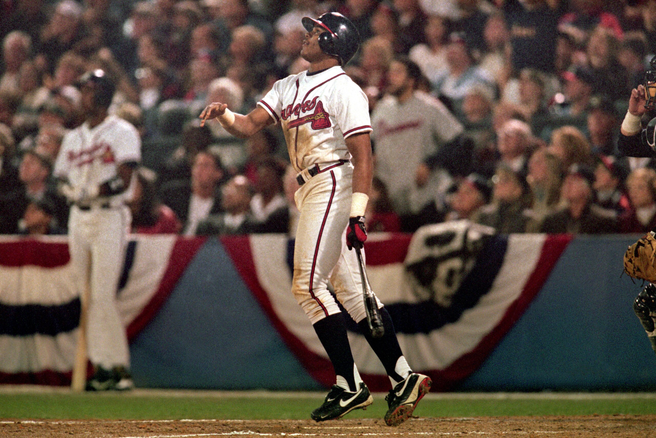 ATLANTA - OCTOBER 24:  Andruw Jones #25 of the Atlanta Braves watches the flight of the ball during Game five of the 1996 World Series against the New York Yankees at Atlanta-Fulton County Stadium on October 24, 1996 in Atlanta, Georgia. The Yankees defea