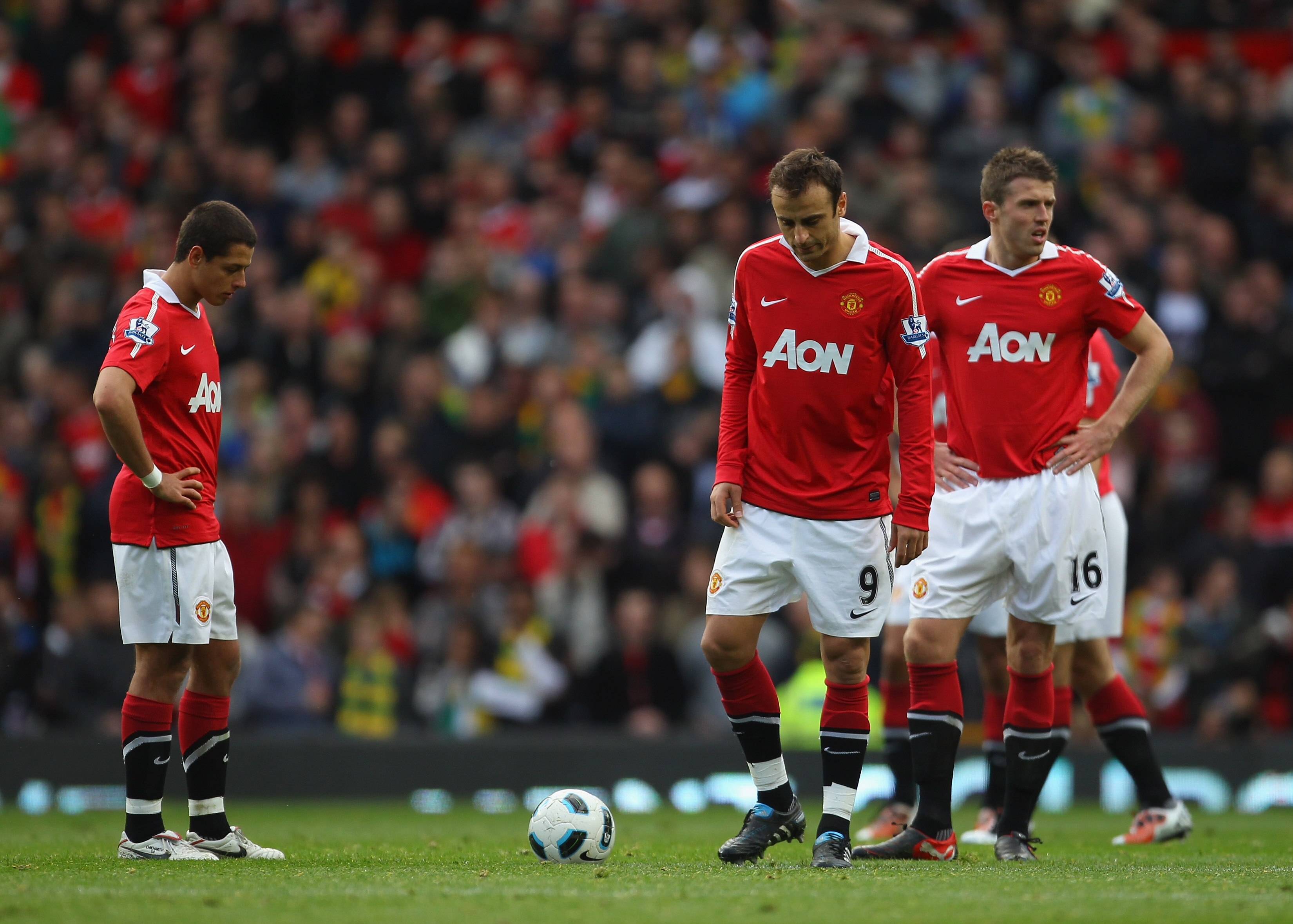 MANCHESTER, ENGLAND - OCTOBER 16:  Javier Hernandez, Dimitar Berbatov and Michael Carrick of Manchester United look dejected after West Bromwich Albion score the equalizing goal during the Barclays Premier League match between Manchester United and West B