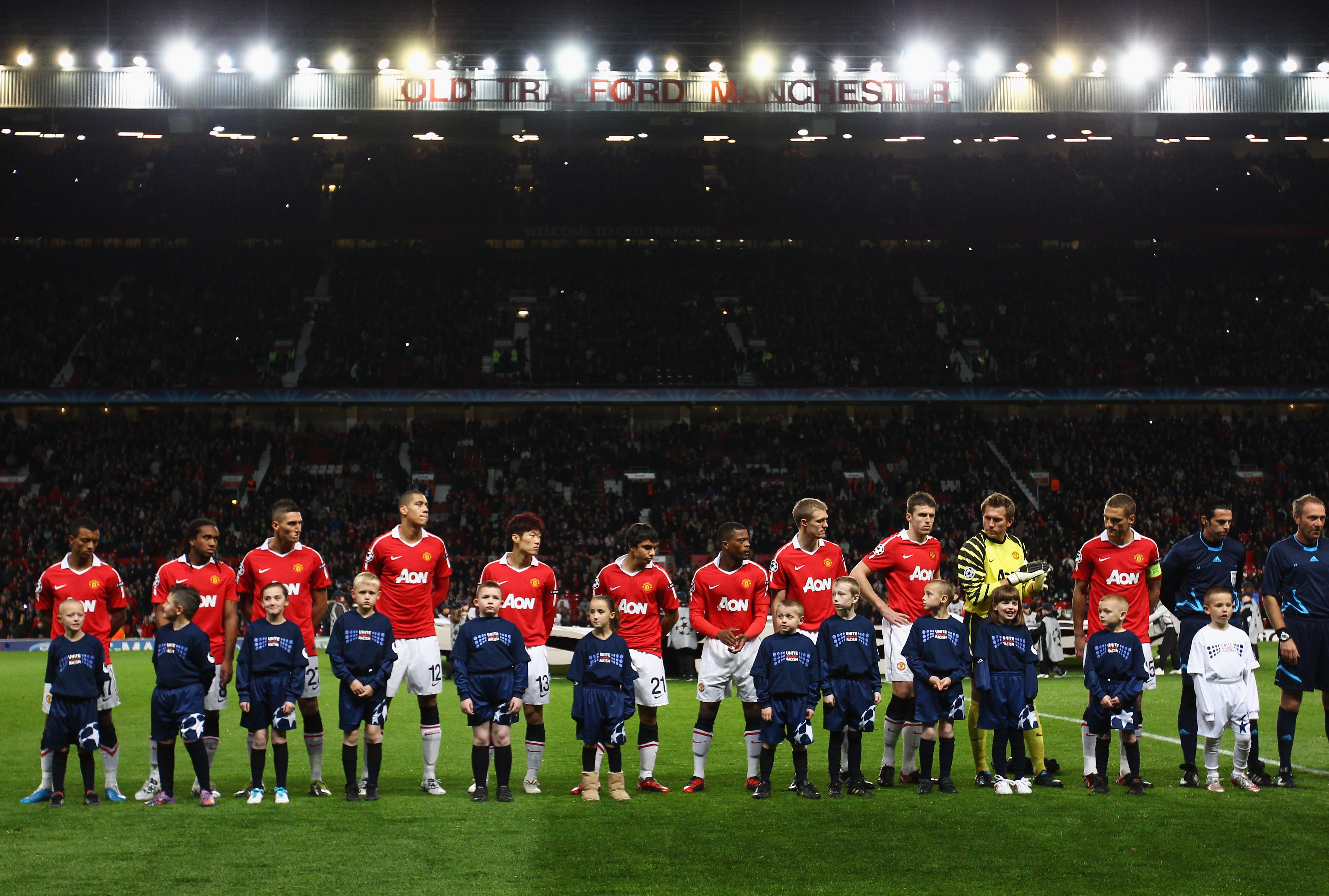 MANCHESTER, ENGLAND - OCTOBER 20:  Manchester United players and mascots line up prior to the UEFA Champions League Group C match between Manchester United and Bursaspor Kulubu at Old Trafford on October 20, 2010 in Manchester, England.  (Photo by Alex Li