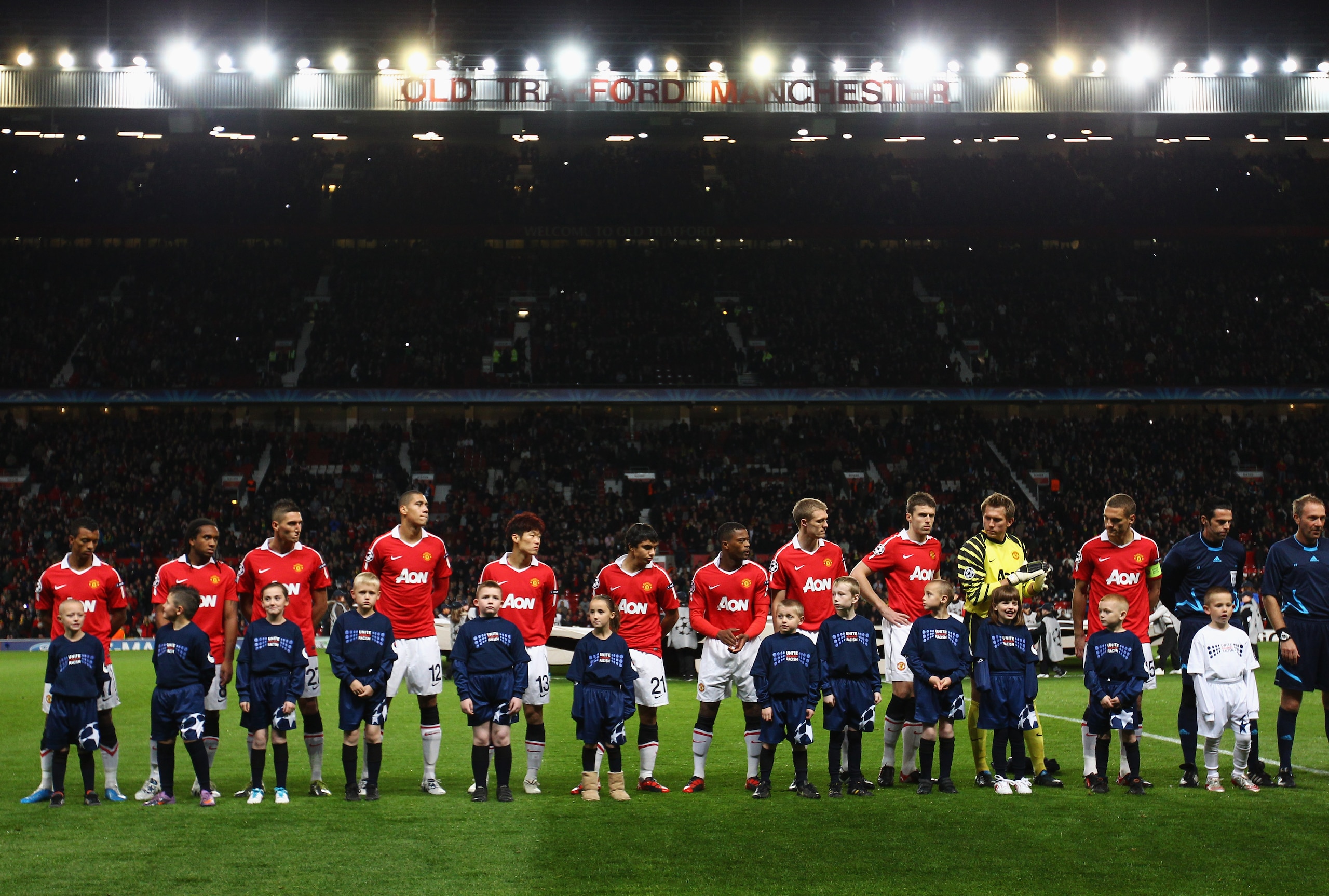 MANCHESTER, ENGLAND - OCTOBER 20:  Manchester United players and mascots line up prior to the UEFA Champions League Group C match between Manchester United and Bursaspor Kulubu at Old Trafford on October 20, 2010 in Manchester, England.  (Photo by Alex Li