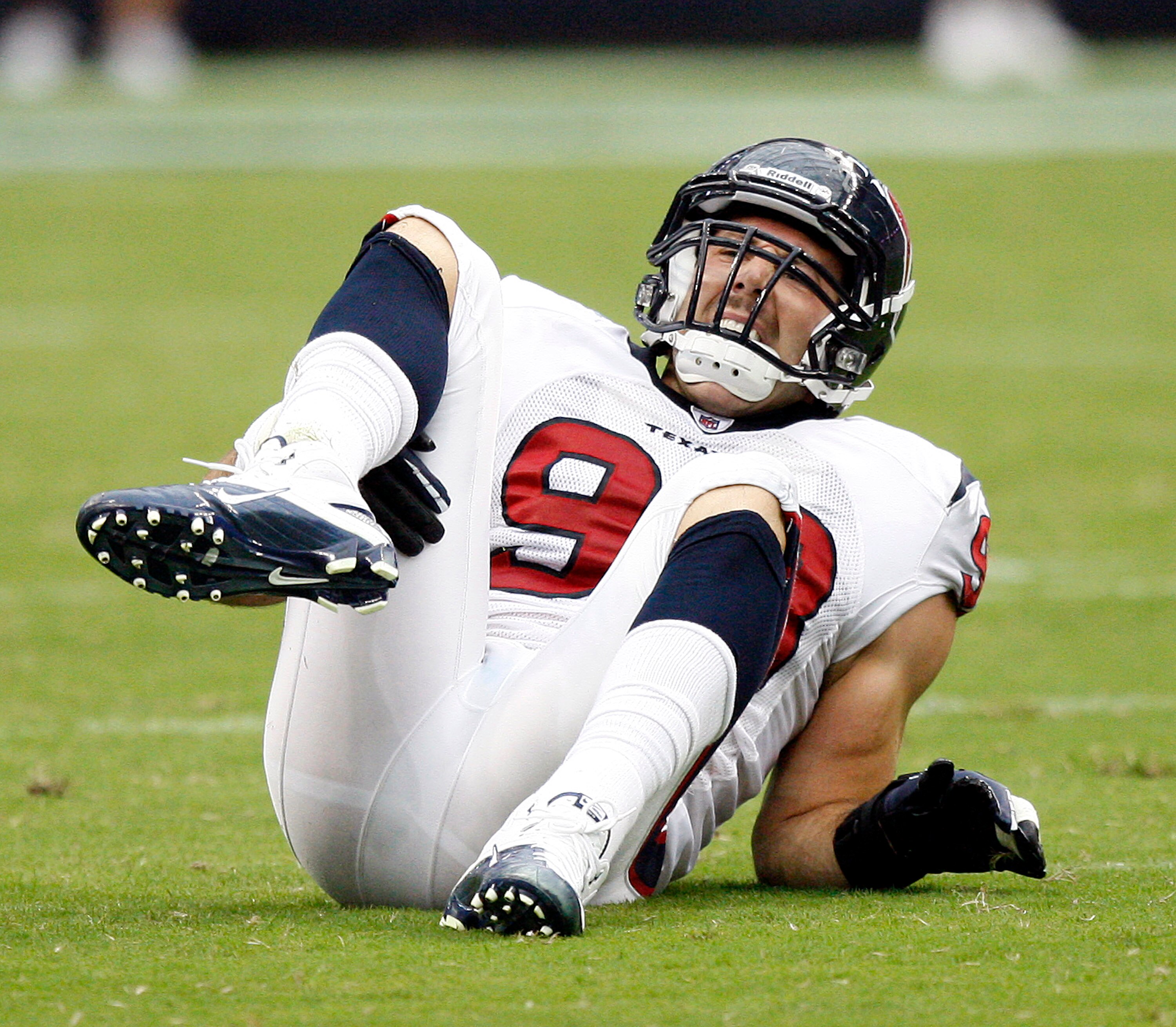 HOUSTON - SEPTEMBER 12:  Defensive end Connor Barwin #98 of the Houston Texans goes down with an injury in the first quarter against the Indianapolis Colts during the NFL season opener at Reliant Stadium on September 12, 2010 in Houston, Texas.  (Photo by