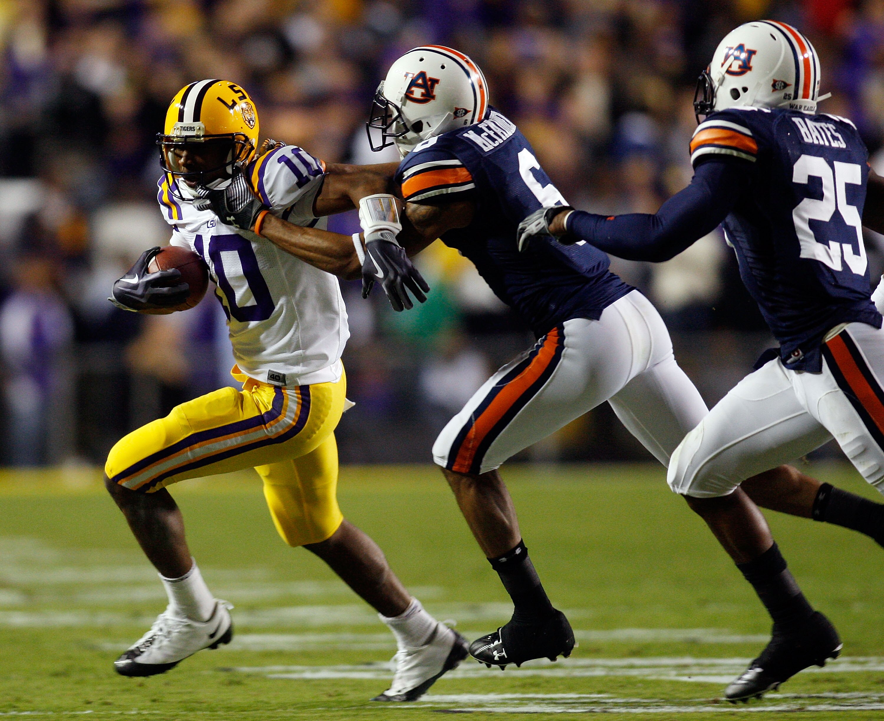 BATON ROUGE, LA - OCTOBER 24:  Russell Shepard #10 of the Louisiana State University Tigers is tackled by Walter McFadden #6 of the Auburn Tigers at Tiger Stadium on October 24, 2009 in Baton Rouge, Louisiana.  (Photo by Chris Graythen/Getty Images)
