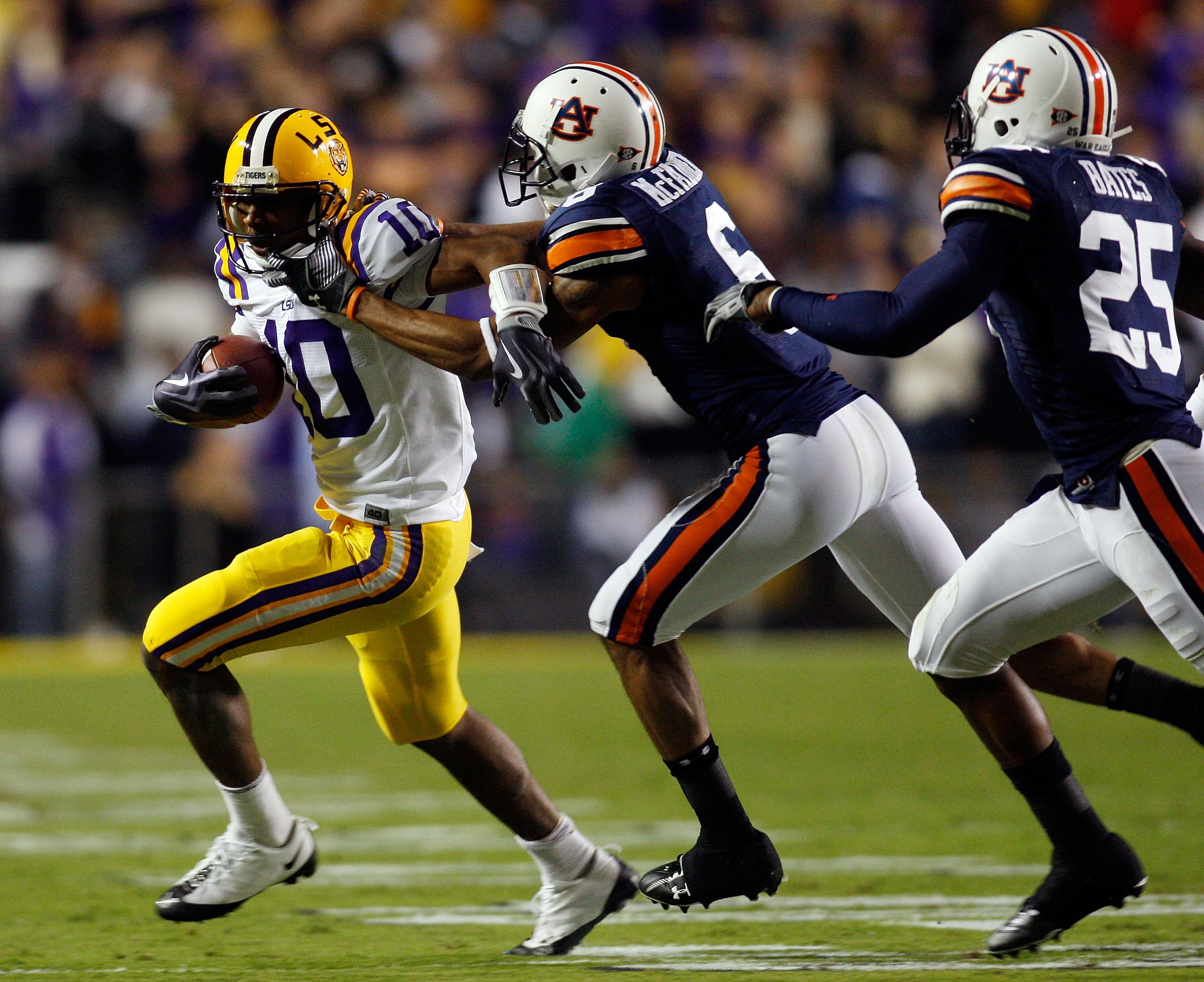 BATON ROUGE, LA - OCTOBER 24:  Russell Shepard #10 of the Louisiana State University Tigers is tackled by Walter McFadden #6 of the Auburn Tigers at Tiger Stadium on October 24, 2009 in Baton Rouge, Louisiana.  (Photo by Chris Graythen/Getty Images)