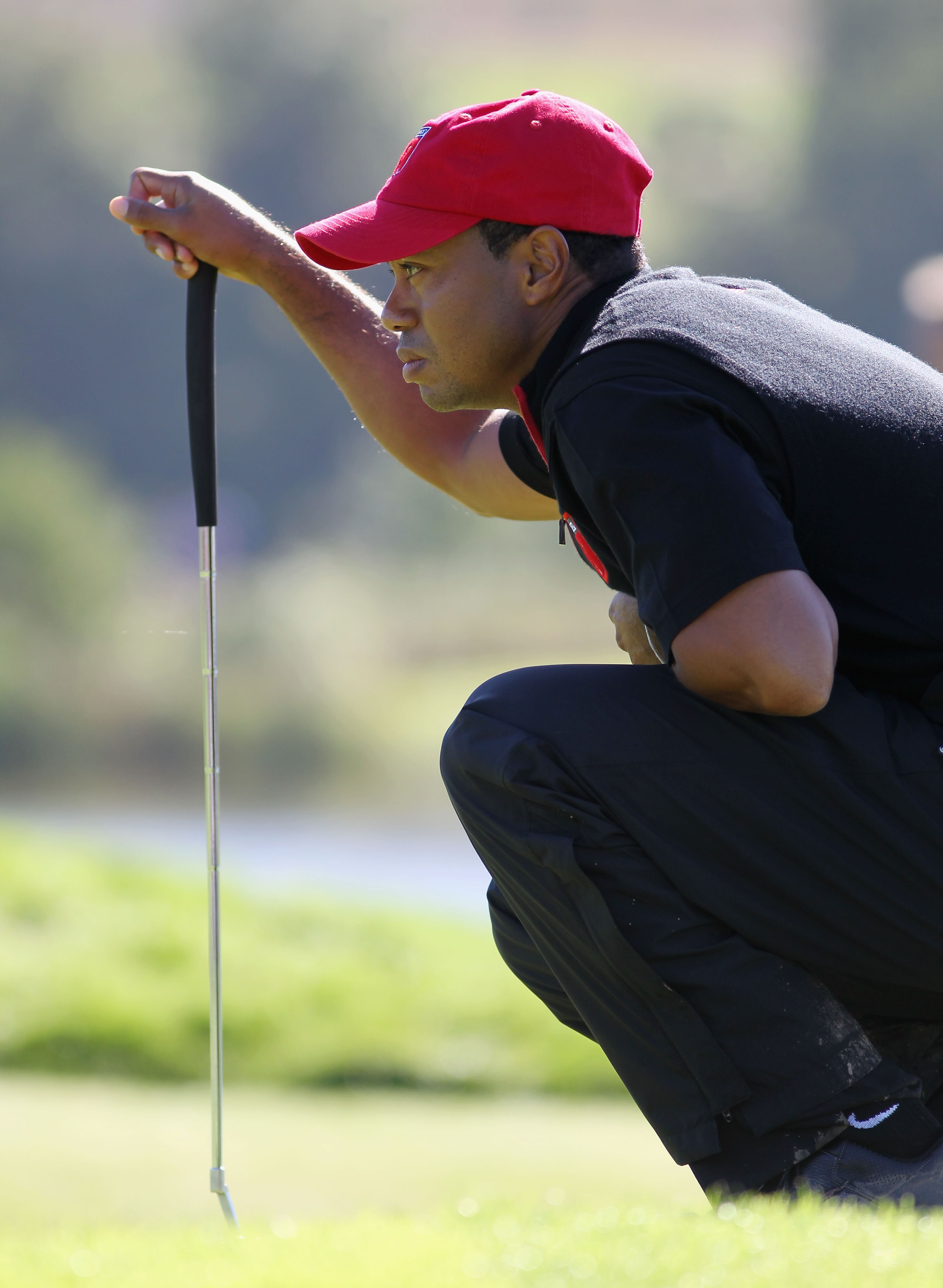 NEWPORT, WALES - OCTOBER 04:  Tiger Woods of the USA lines up a putt in the singles matches during the 2010 Ryder Cup at the Celtic Manor Resort on October 4, 2010 in Newport, Wales.  (Photo by Jamie Squire/Getty Images)