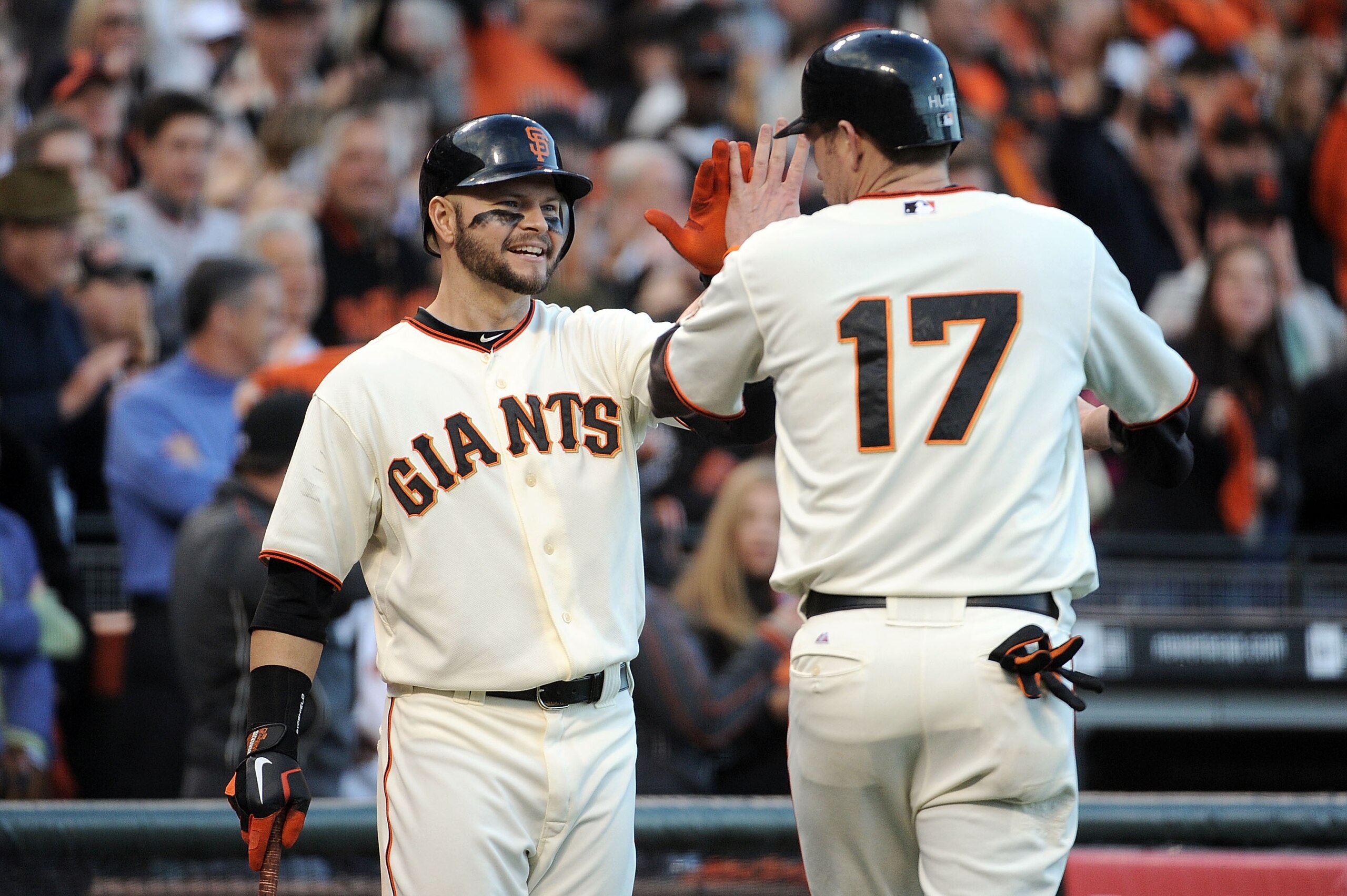 SAN FRANCISCO - OCTOBER 20:  (R-L) Aubrey Huff #17 of the San Francisco Giants celebrates with Cody Ross #13 after scoring against the Philadelphia Phillies on a double by Buster Posey in the third inning of Game Four of the NLCS during the 2010 MLB Playo