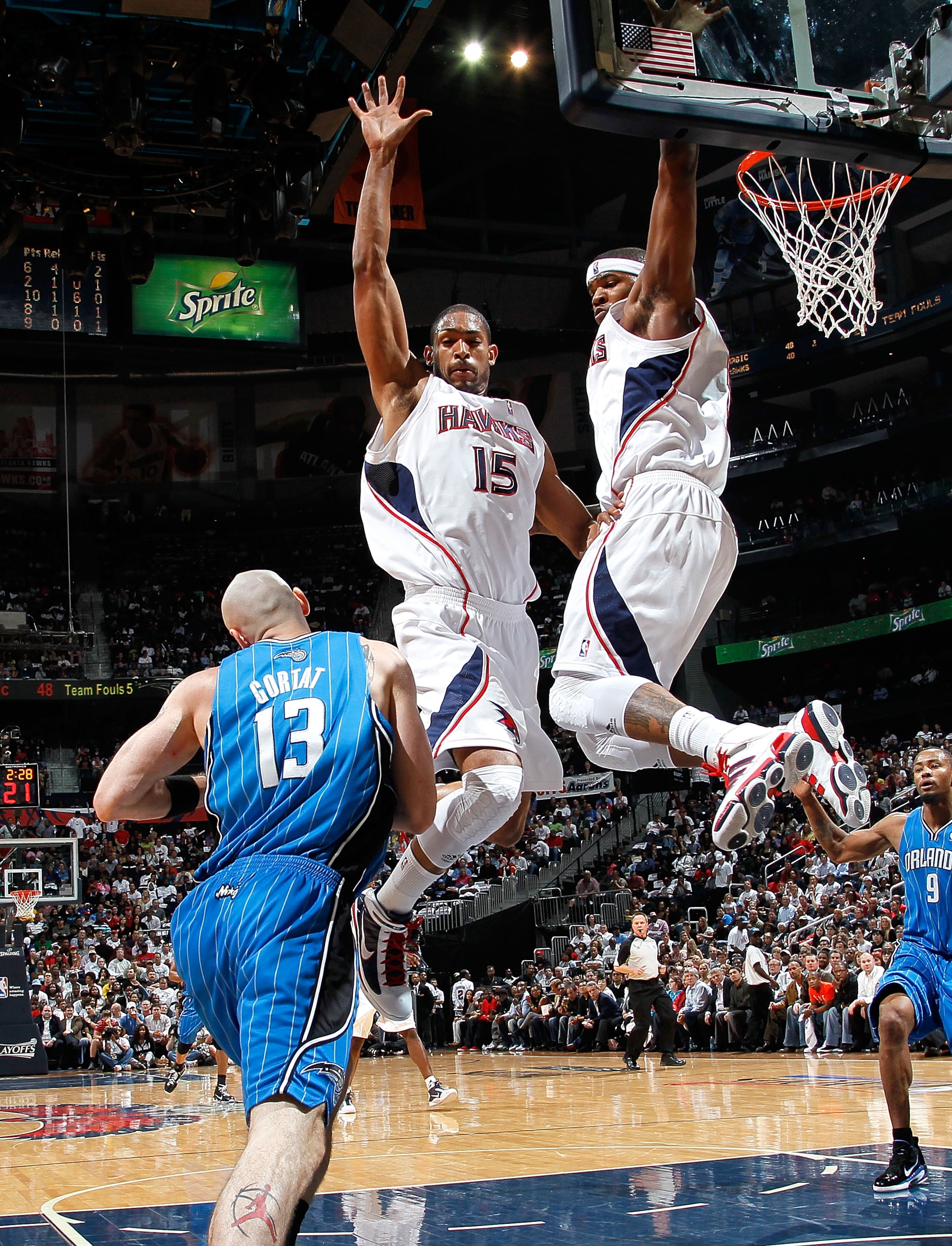 ATLANTA - MAY 10:  Al Horford #15 and Josh Smith #5 of the Atlanta Hawks defend the basket against Marcin Gortat #13 of the Orlando Magic during Game Four of the Eastern Conference Semifinals of the 2010 NBA Playoffs at Philips Arena on May 10, 2010 in At