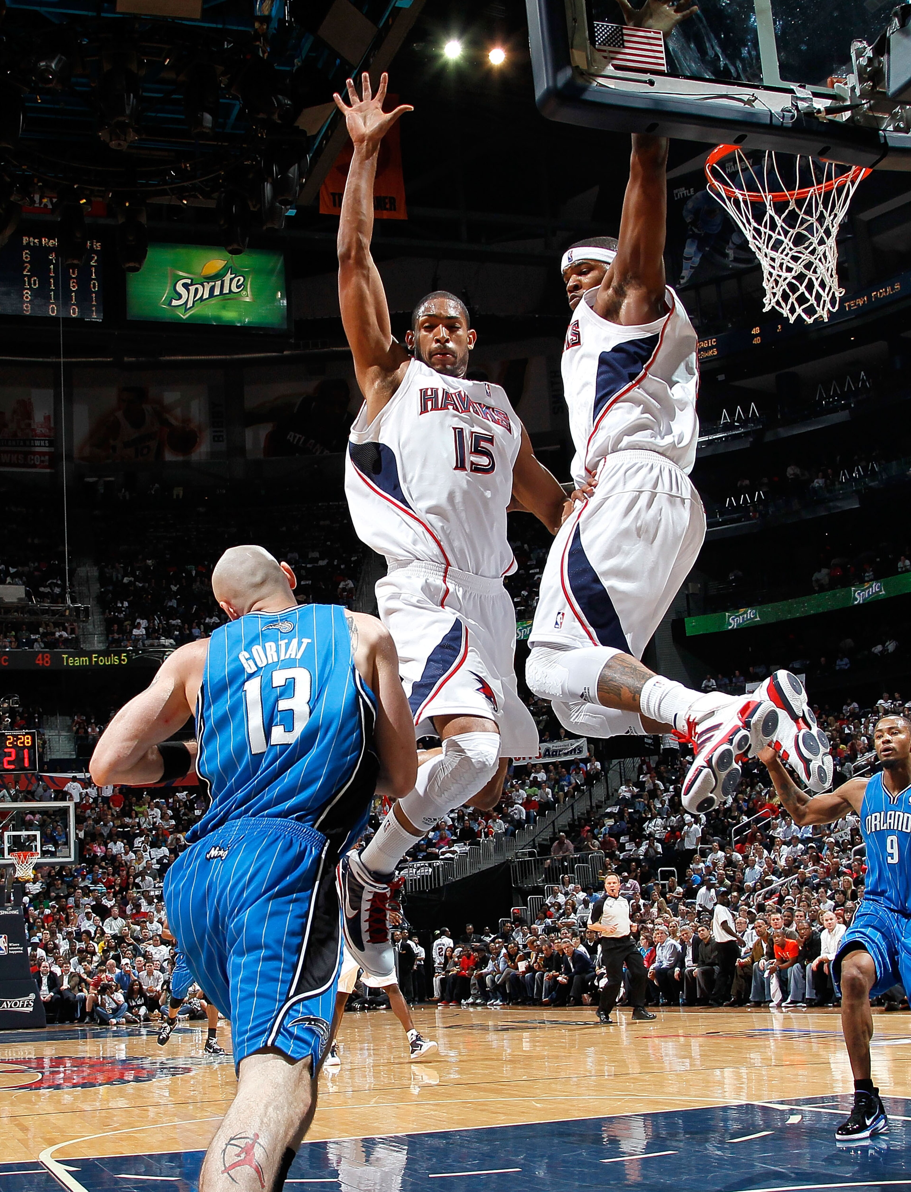 ATLANTA - MAY 10:  Al Horford #15 and Josh Smith #5 of the Atlanta Hawks defend the basket against Marcin Gortat #13 of the Orlando Magic during Game Four of the Eastern Conference Semifinals of the 2010 NBA Playoffs at Philips Arena on May 10, 2010 in At