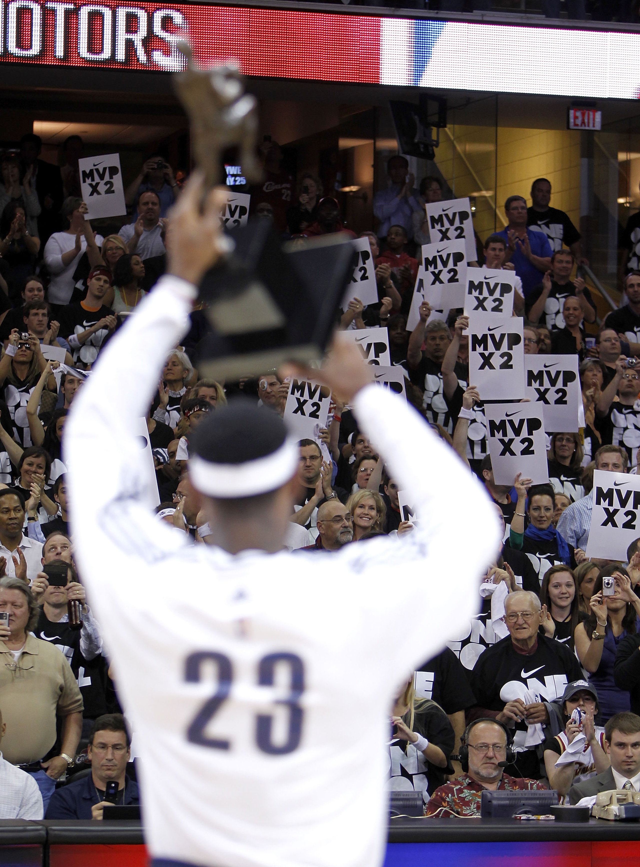 CLEVELAND - MAY 03: Fans show support of LeBron James #23 of the Cleveland Cavaliers as he holds up the Maurice Podoloff Trophy after being named the 2009-2010 NBA MVP prior to playing the Boston Celtics in Game Two of the Eastern Conference Semifinals du