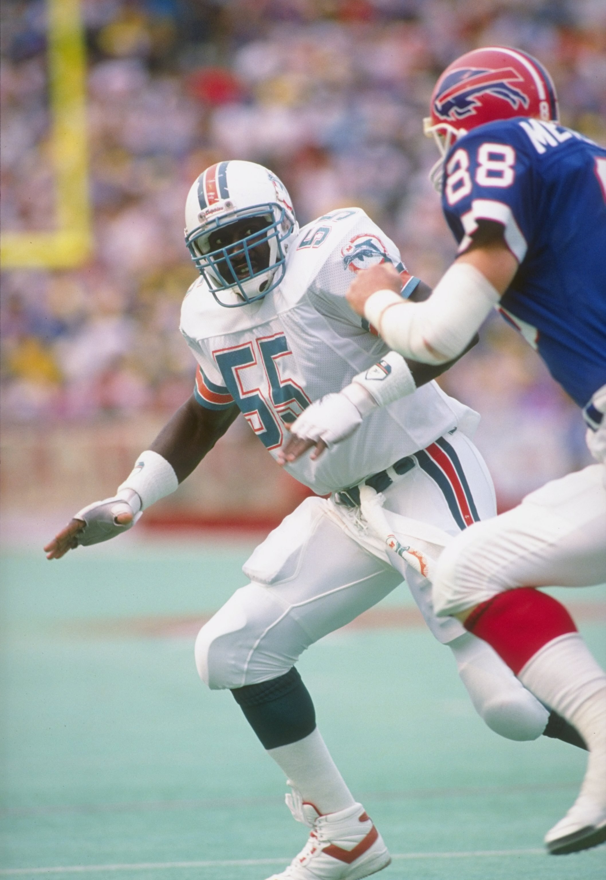 1 Sep 1991:  Linebacker Hugh Green of the Miami Dolphins (left) in action during a game against the Buffalo Bills at Rich Stadium in Orchard Park, New York.  The Bills won the game 35-31. Mandatory Credit: Rick Stewart  /Allsport