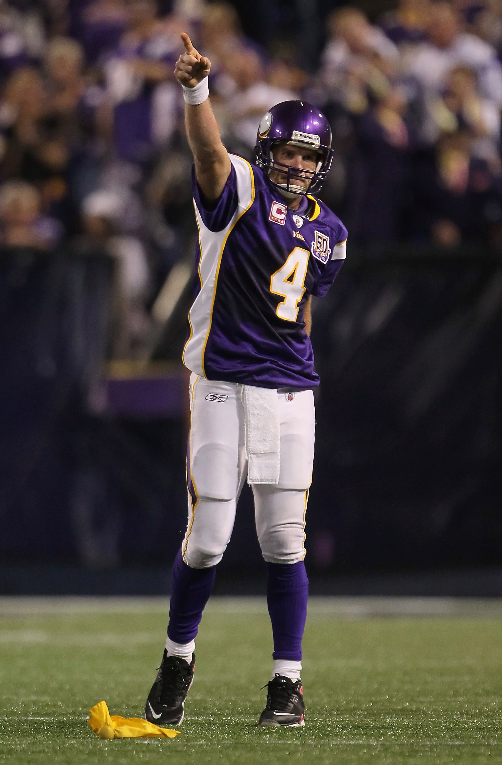 MINNEAPOLIS - OCTOBER 17:  Quarterback Brett Favre #4 of the Minnesota Vikings celebrates a pass interference call against Mike Jenkins (not pictured) of the Dallas Cowboys during the fourth quarter at Mall of America Field on October 17, 2010 in Minneapo