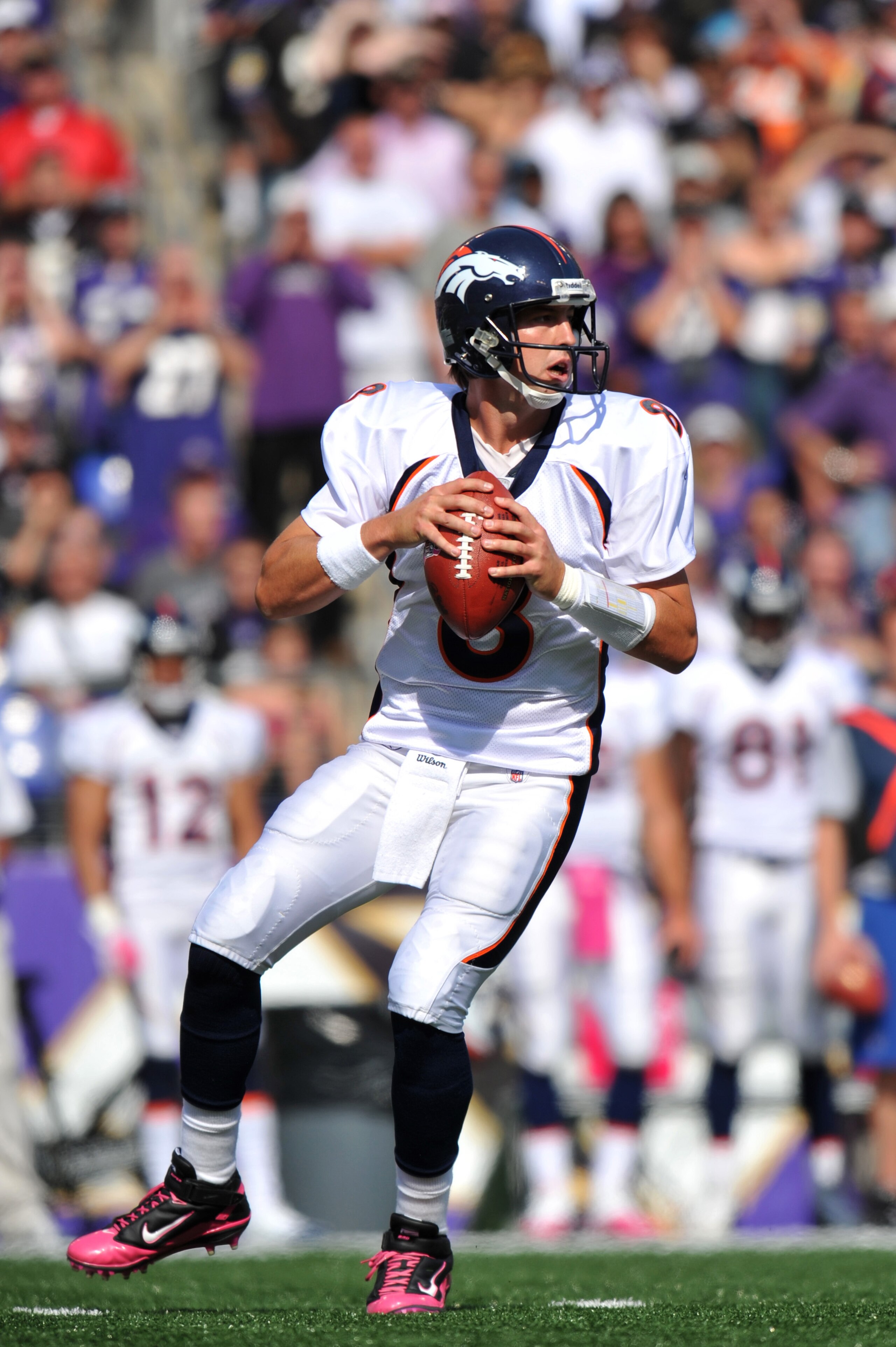 BALTIMORE, MD - OCTOBER 10: Kyle Orton #8 of the Denver Broncos passes against the Baltimore Ravens at M&T Bank Stadium on October 10, 2010 in Baltimore, Maryland. Players wore pink in recognition of Breast Cancer Awareness Month. The Ravens defeated the