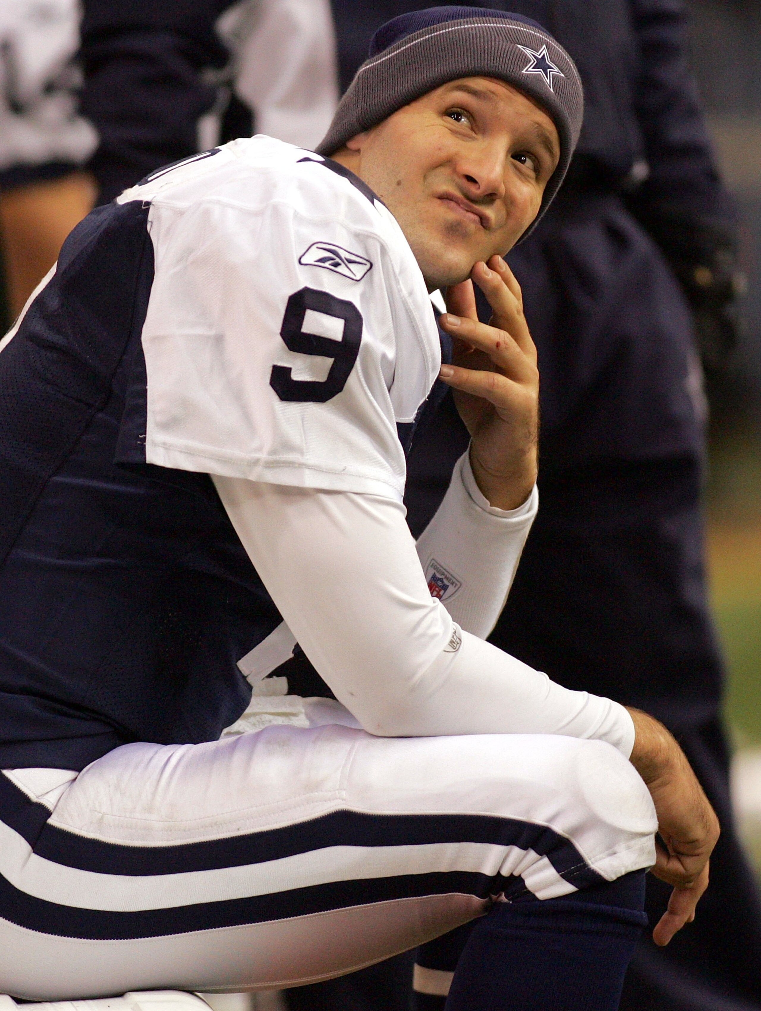 IRVING, TX - DECEMBER 25:  Quarterback Tony Romo #9 of the Dallas Cowboys sits on the bench after throwing a pass interception against the Philadelphia Eagles on December 25, 2006 at Texas Stadium in Irving, Texas.  (Photo by Ronald Martinez/Getty Images)