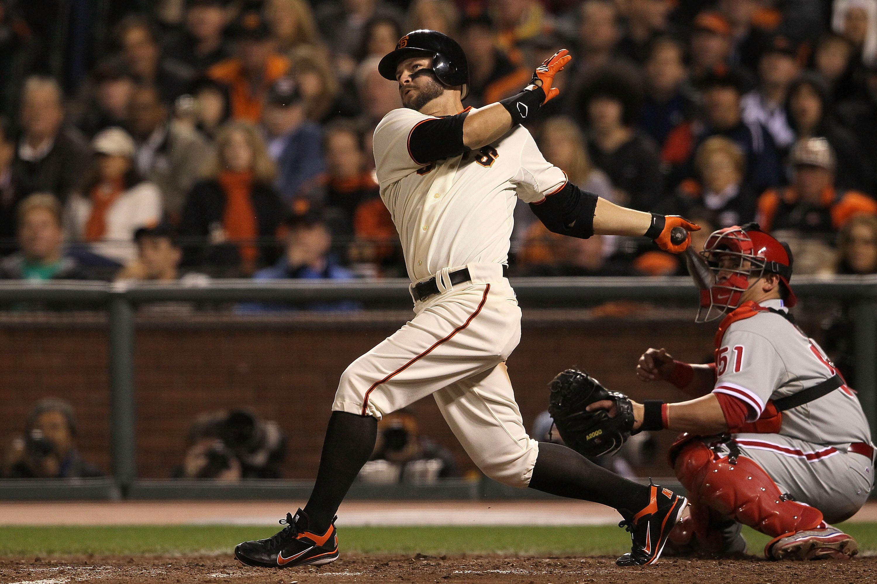 SAN FRANCISCO - OCTOBER 20:  Cody Ross #13 of the San Francisco Giants hits a double in the sixth inning against the Philadelphia Phillies in Game Four of the NLCS during the 2010 MLB Playoffs at AT&T Park on October 20, 2010 in San Francisco, California.