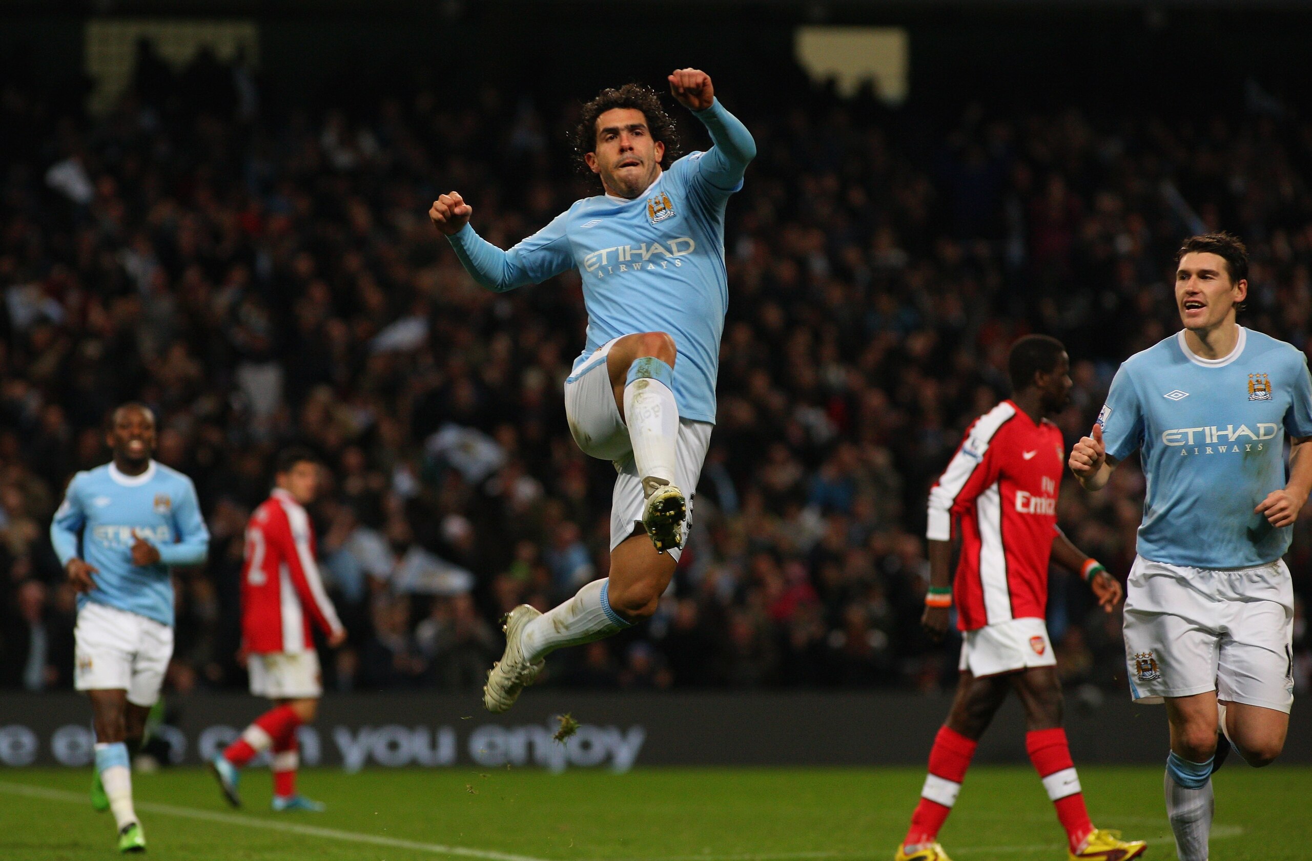 MANCHESTER, ENGLAND - DECEMBER 02:  Carlos Tevez of Man City (c) celebrates his goal during the Carling Cup quarter final match between Manchester City and Arsenal at City of Manchester stadium on December 2, 2009 in Manchester, England.  (Photo by Stu Fo