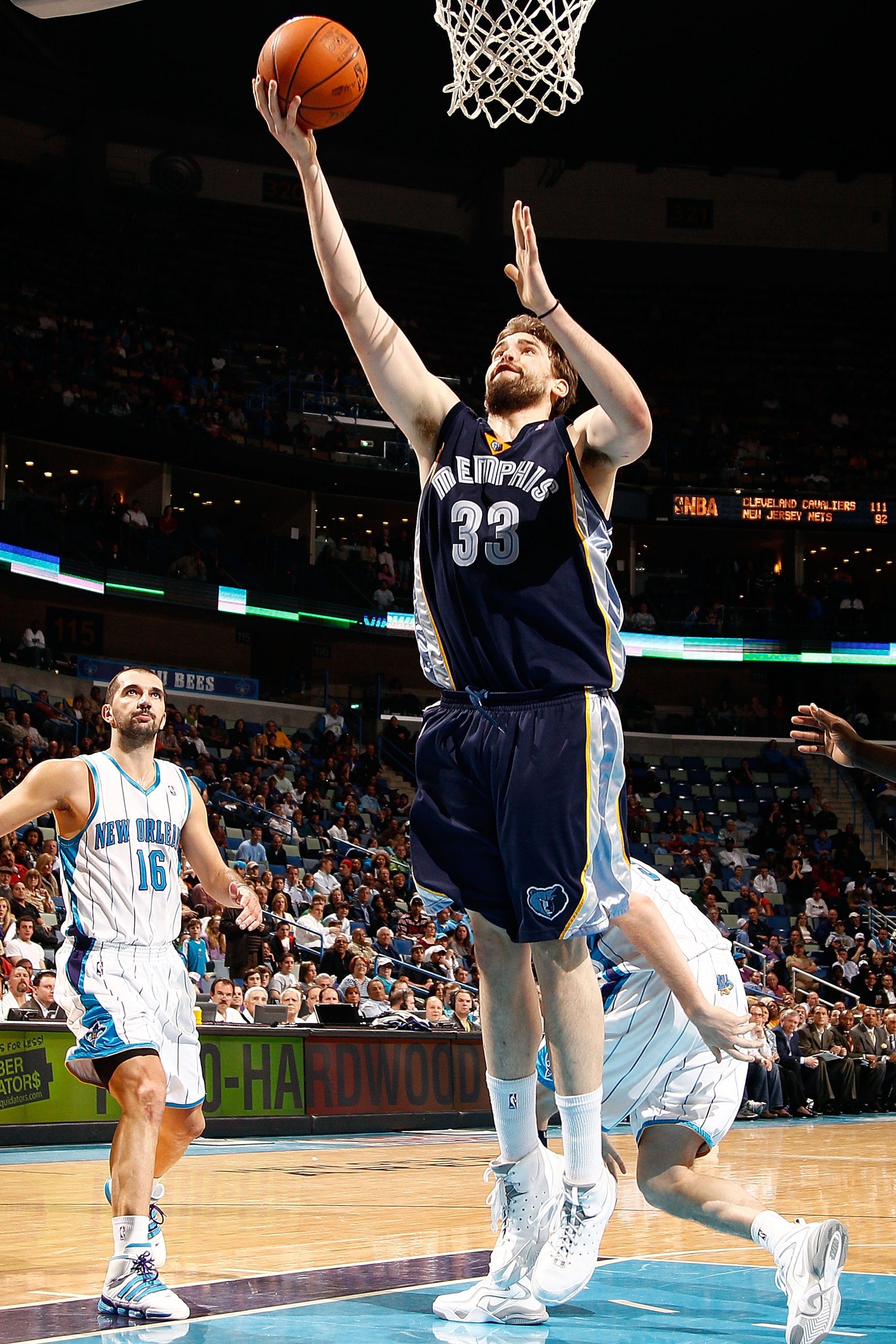 NEW ORLEANS - MARCH 03:  Marc Gasol #33of the Memphis Grizzlies shoots the ball around Peja Stojakovic #16 of the New Orleans Hornets at the New Orleans Arena on March 3, 2010 in New Orleans, Louisiana.  The Grizzlies defeated the Hornets 104-100.  NOTE T