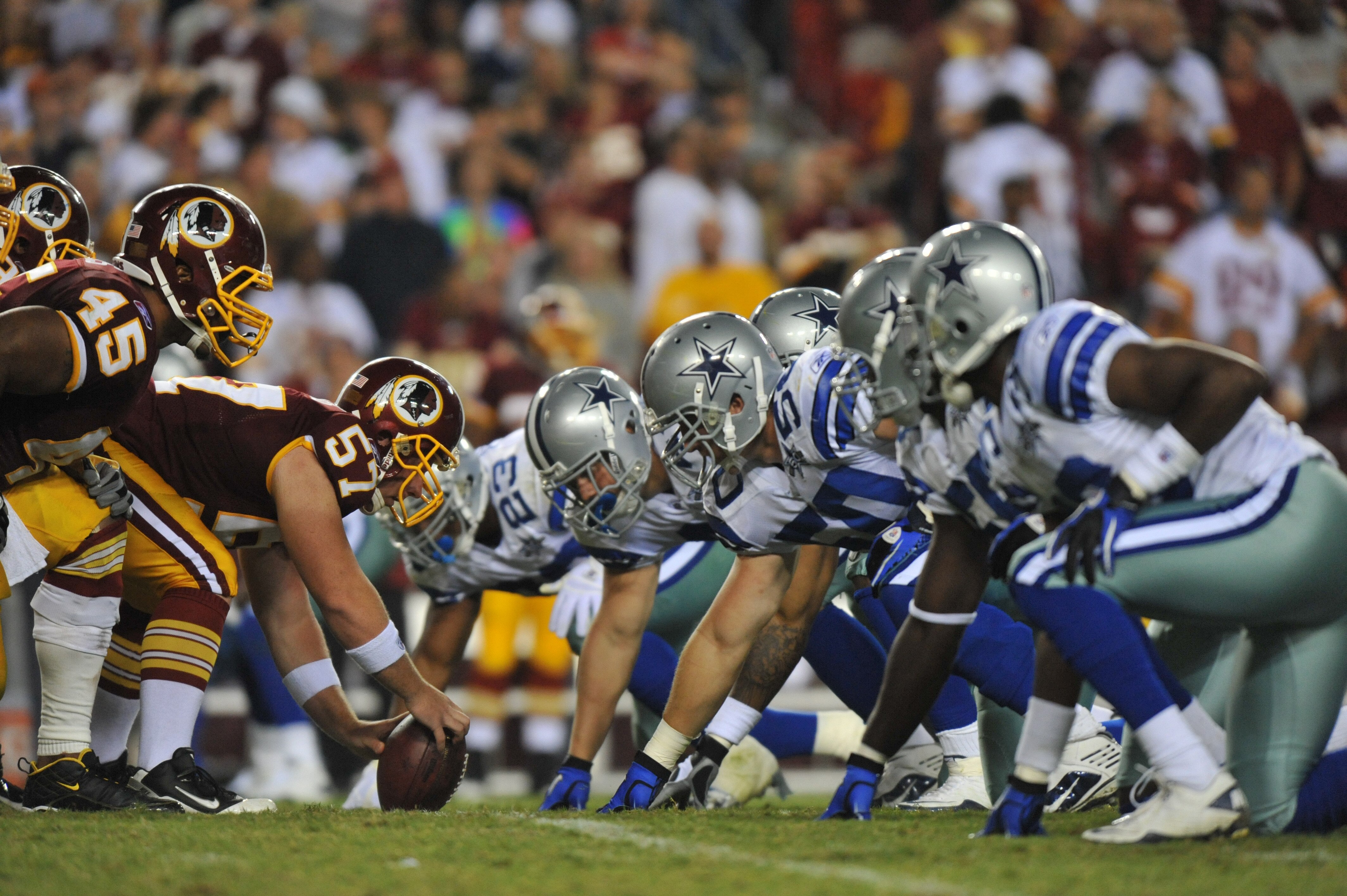 LANDOVER - SEPTEMBER 12:  Nick Sundberg #57 of the Washington Redskins prepares to snap the ball during the NFL season opener against the Dallas Cowboys at FedExField on September 12, 2010 in Landover, Maryland. The Redskins defeated the Cowboys 13-7. (Ph