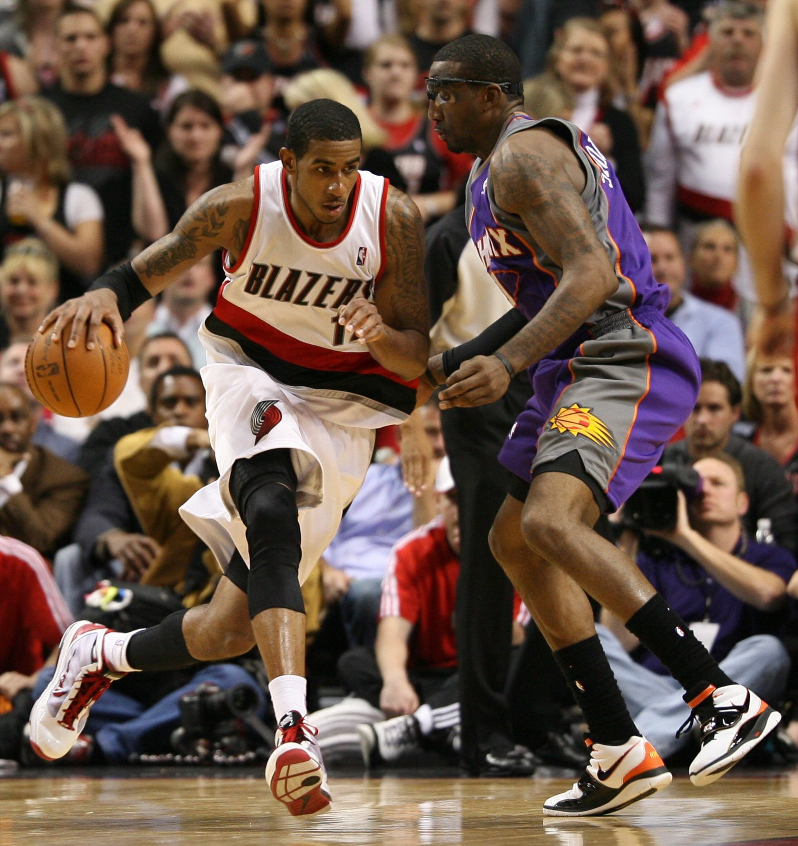 PORTLAND, OR - APRIL 29:  LaMarcus Aldridge #12 of the Portland Trail Blazers in action against Amare Stoudemire #1 of the Phoenix Suns during Game Six of the Western Conference Quarterfinals of the NBA Playoffs on April 29, 2010 at the Rose Garden in Por