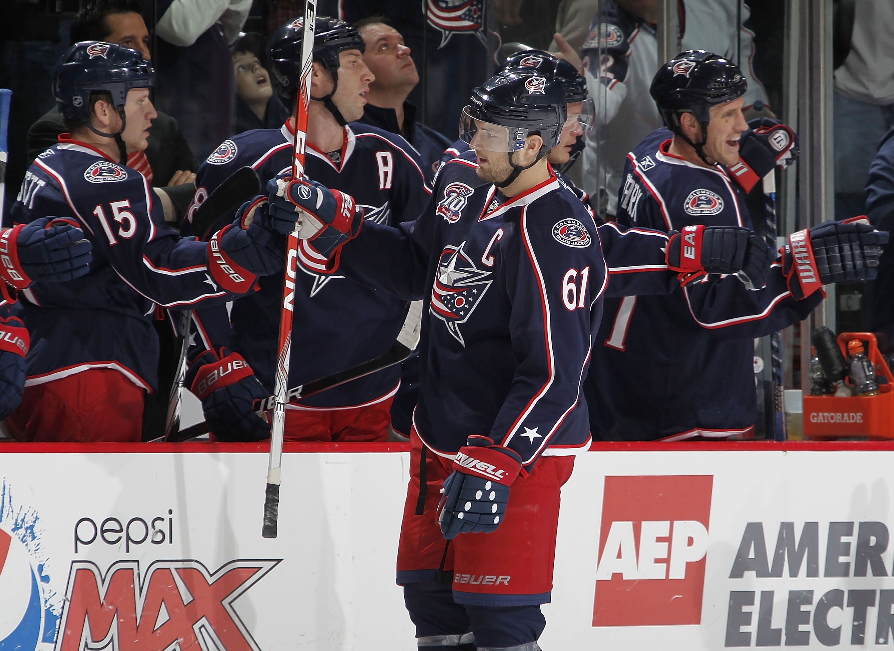 COLUMBUS, OH - OCTOBER 20:  Rick Nash #61 of the Columbus Blue Jackets is congradulated by teammates after a third period empty net goal against the Anaheim Ducks on October 20, 2010 at Nationwide Arena in Columbus, Ohio.  (Photo by Gregory Shamus/Getty I