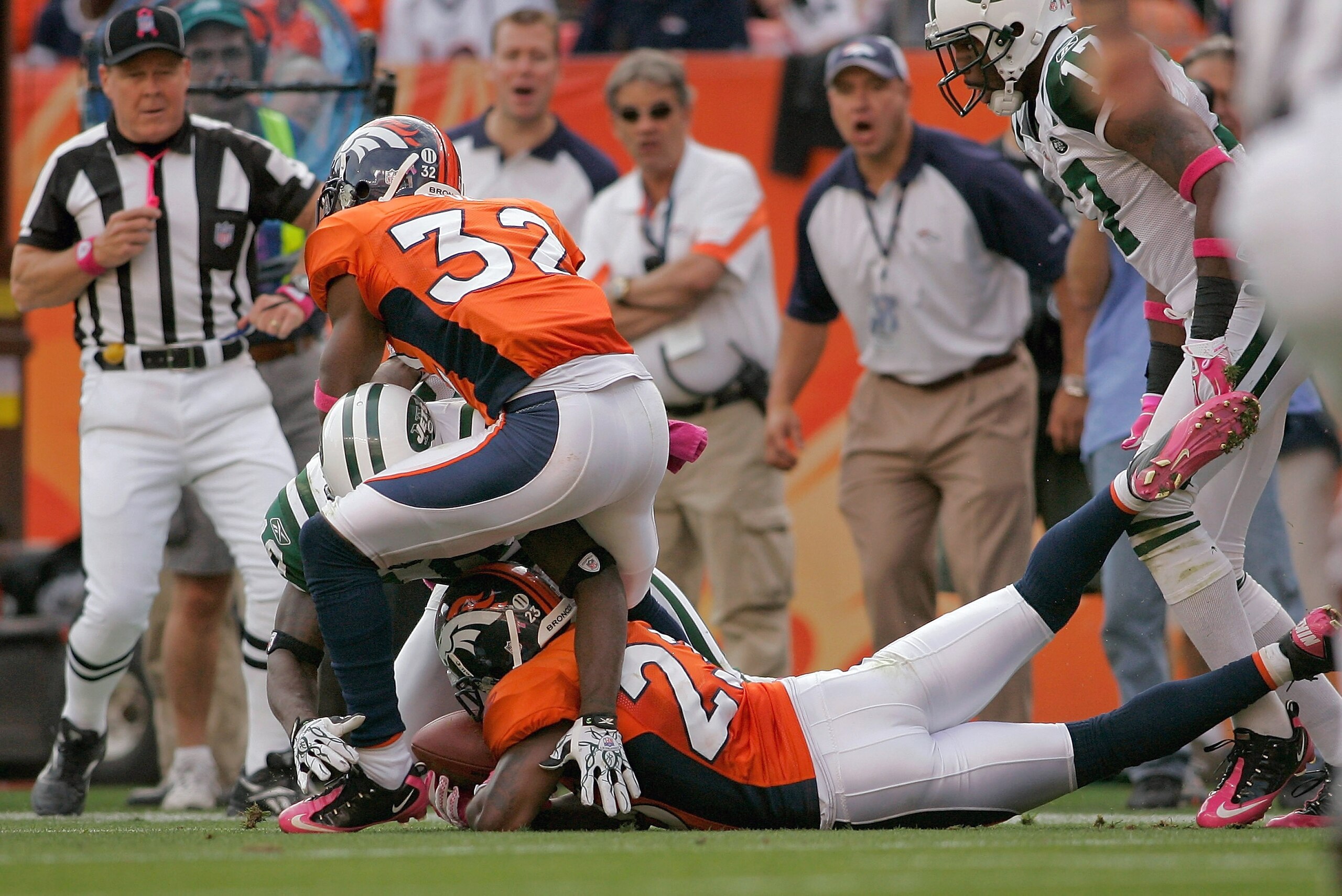 DENVER - OCTOBER 17:  Renaldo Hill #23 of the Denver Broncos recovers a fumble by Santonio Holmes #10 of the New York Jets in the third quarter at INVESCO Field at Mile High on October 17, 2010 in Denver, Colorado.  (Photo by Justin Edmonds/Getty Images)