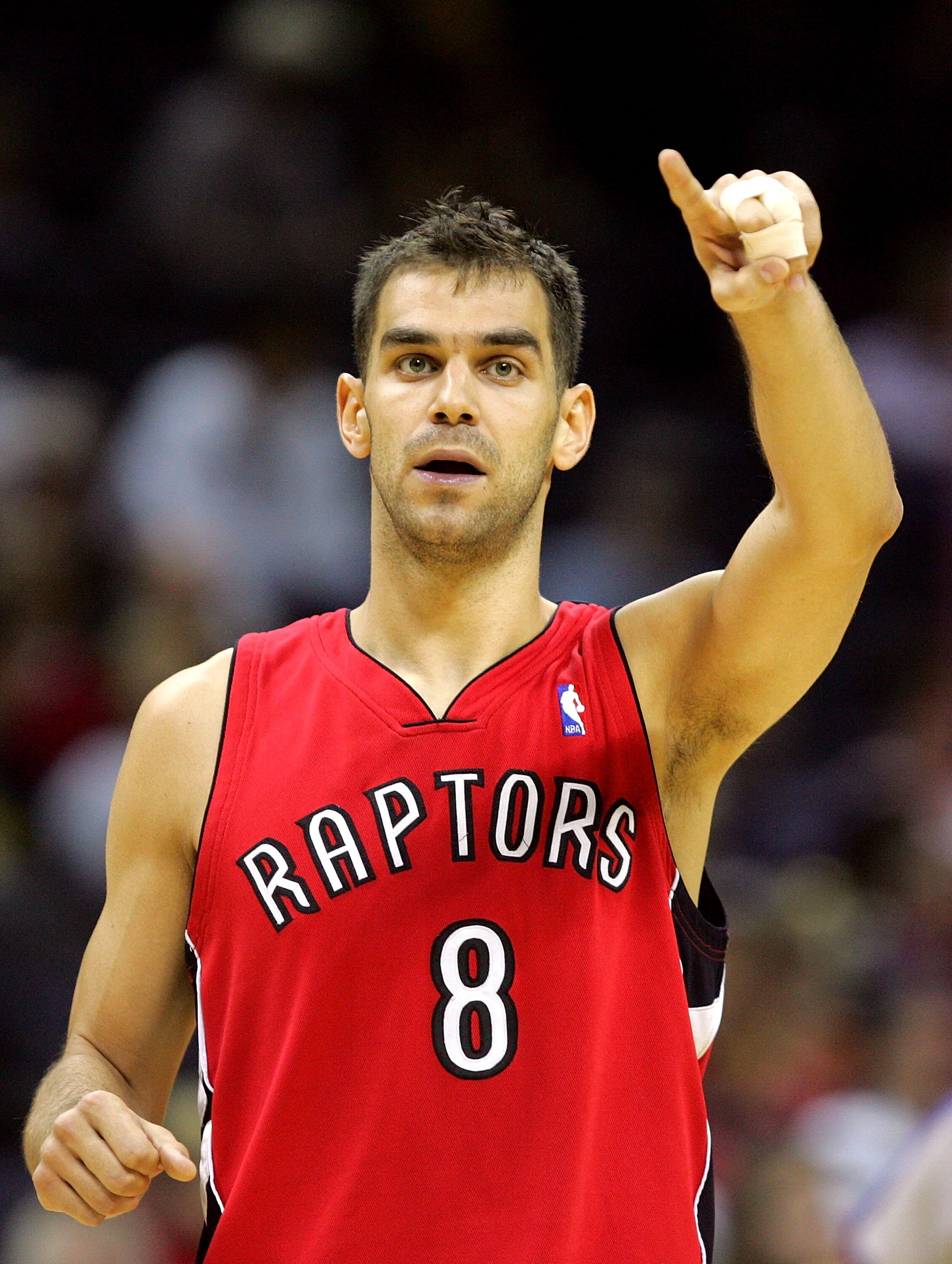 CHARLOTTE, NC - MARCH 02:  Jose Calderon #8 of the Toronto Raptors points to his teammates against the Charlotte Bobcats during their game at Bobcats Arena on March 2, 2008 in Charlotte, North Carolina. NOTE TO USER: User expressly acknowledges and agrees