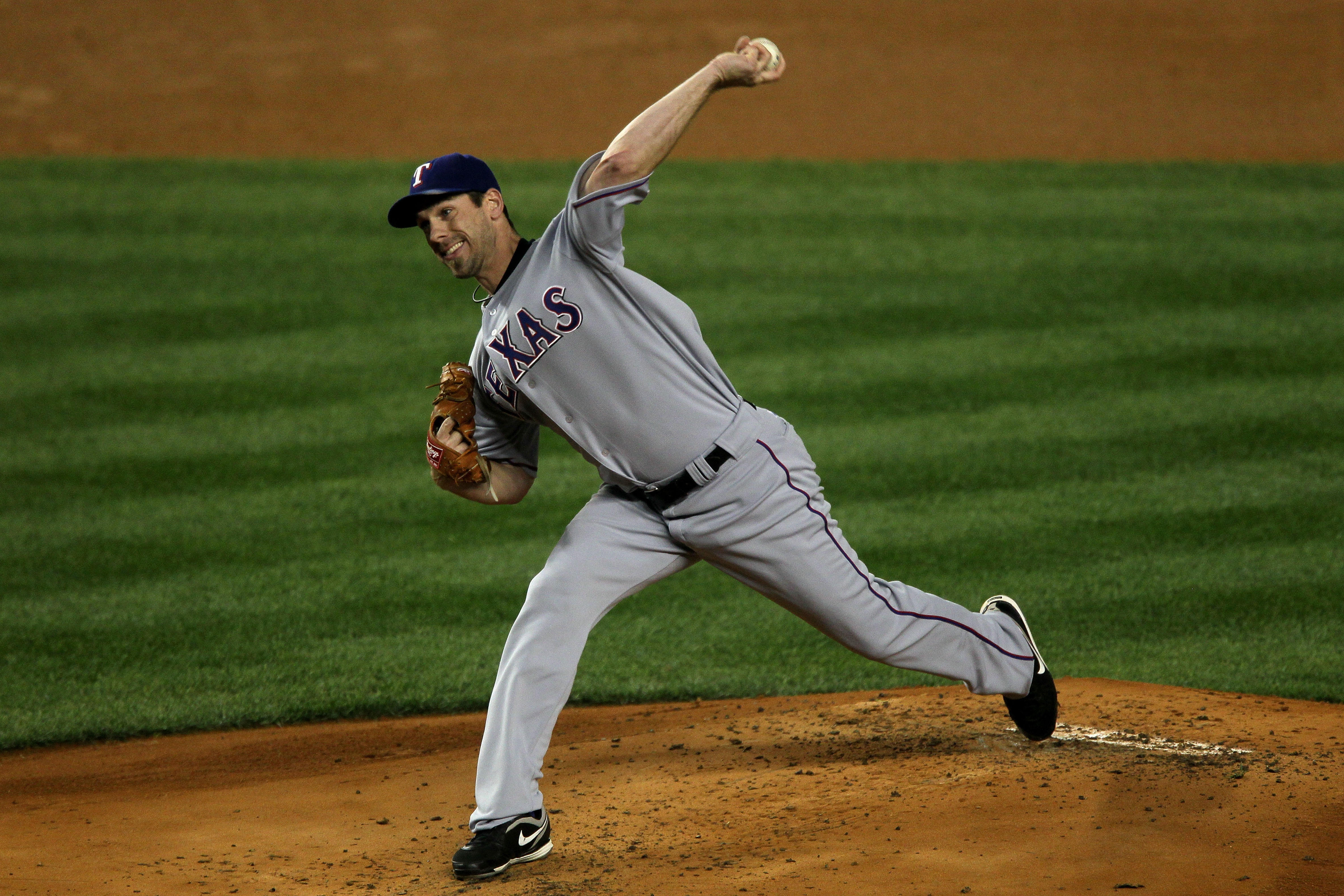 NEW YORK - OCTOBER 18:  Cliff Lee #33 of the Texas Rangers throws a pitch against the New York Yankees in Game Three of the ALCS during the 2010 MLB Playoffs at Yankee Stadium on October 18, 2010 in New York, New York.  (Photo by Jim McIsaac/Getty Images)