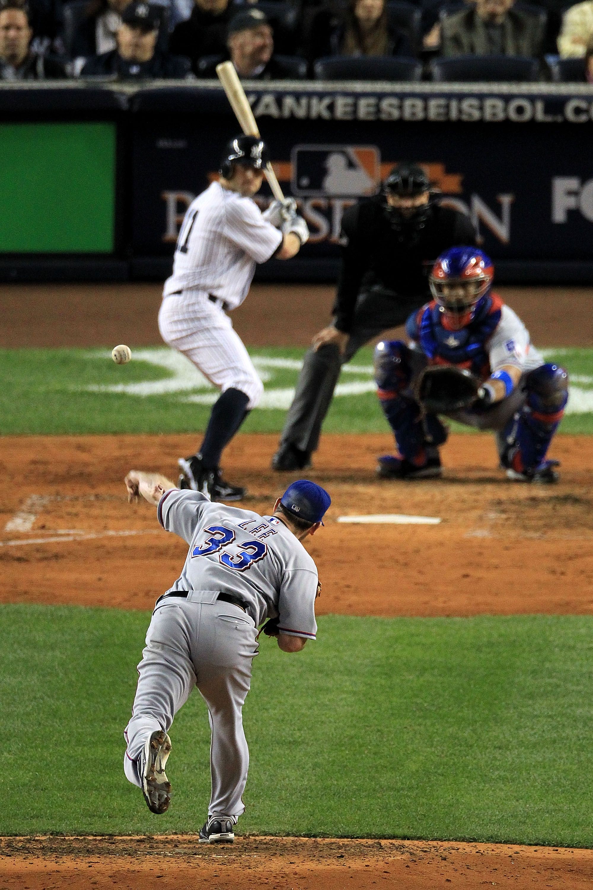 NEW YORK - OCTOBER 18:  Cliff Lee #33 of the Texas Rangers throws a pitch against Brett Gardner #11 of the New York Yankees in Game Three of the ALCS during the 2010 MLB Playoffs at Yankee Stadium on October 18, 2010 in New York, New York.  (Photo by Trav
