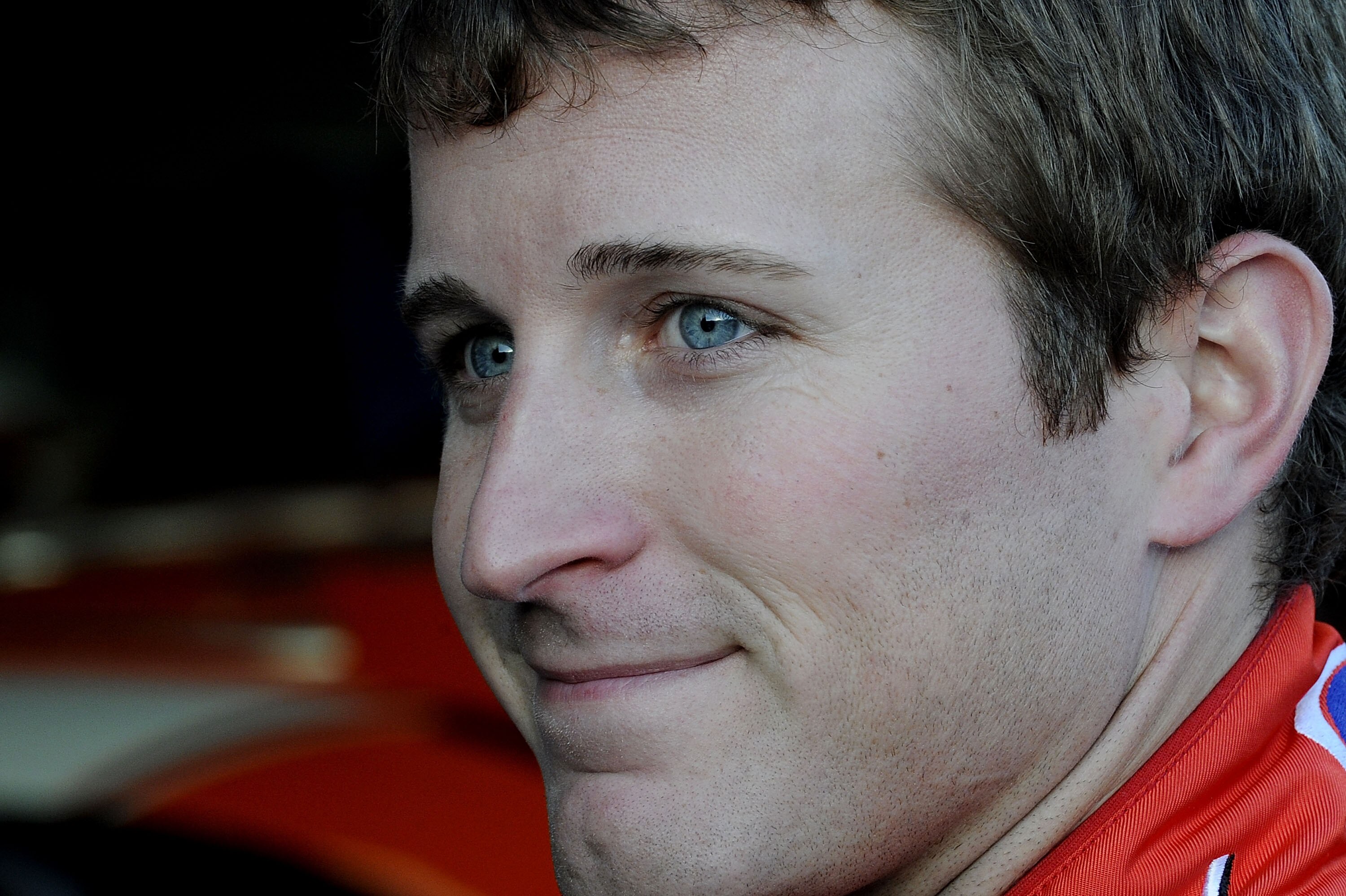 CONCORD, NC - OCTOBER 15:  Kasey Kahne, driver of the #9 Budweiser Ford, stands in the garage during practice for the NASCAR Sprint Cup Series Bank of America 500 at Charlotte Motor Speedway on October 15, 2010 in Concord, North Carolina.  (Photo by John