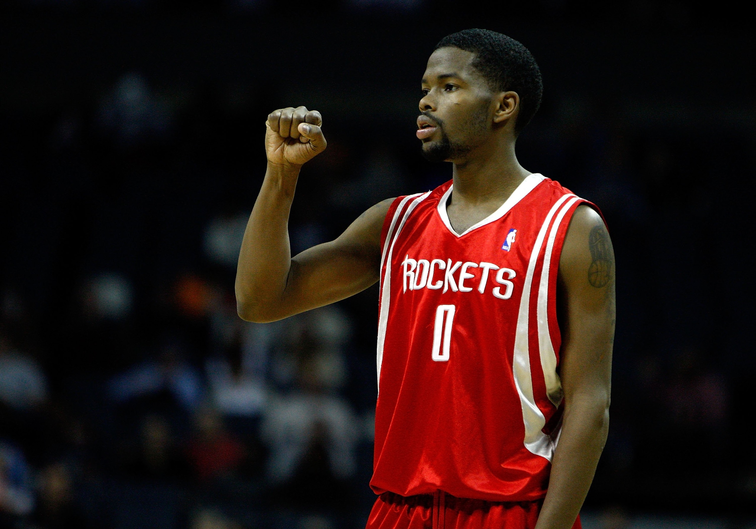 CHARLOTTE, NC - JANUARY 12: Aaron Brooks #0 of the Houston Rockets reacts during the game against the Charlotte Bobcats on January 12, 2010 at Time Warner Cable Arena in Charlotte, North Carolina. The Bobcats won 102-94. NOTE TO USER: User expressly ac CHARLOTTE, NC - JANUARY 12: Aaron Brooks #0 of the Houston Rockets reacts during the game against the Charlotte Bobcats on January 12, 2010 at Time Warner Cable Arena in Charlotte, North Carolina. The Bobcats won 102-94. NOTE TO USER: User expressly ac