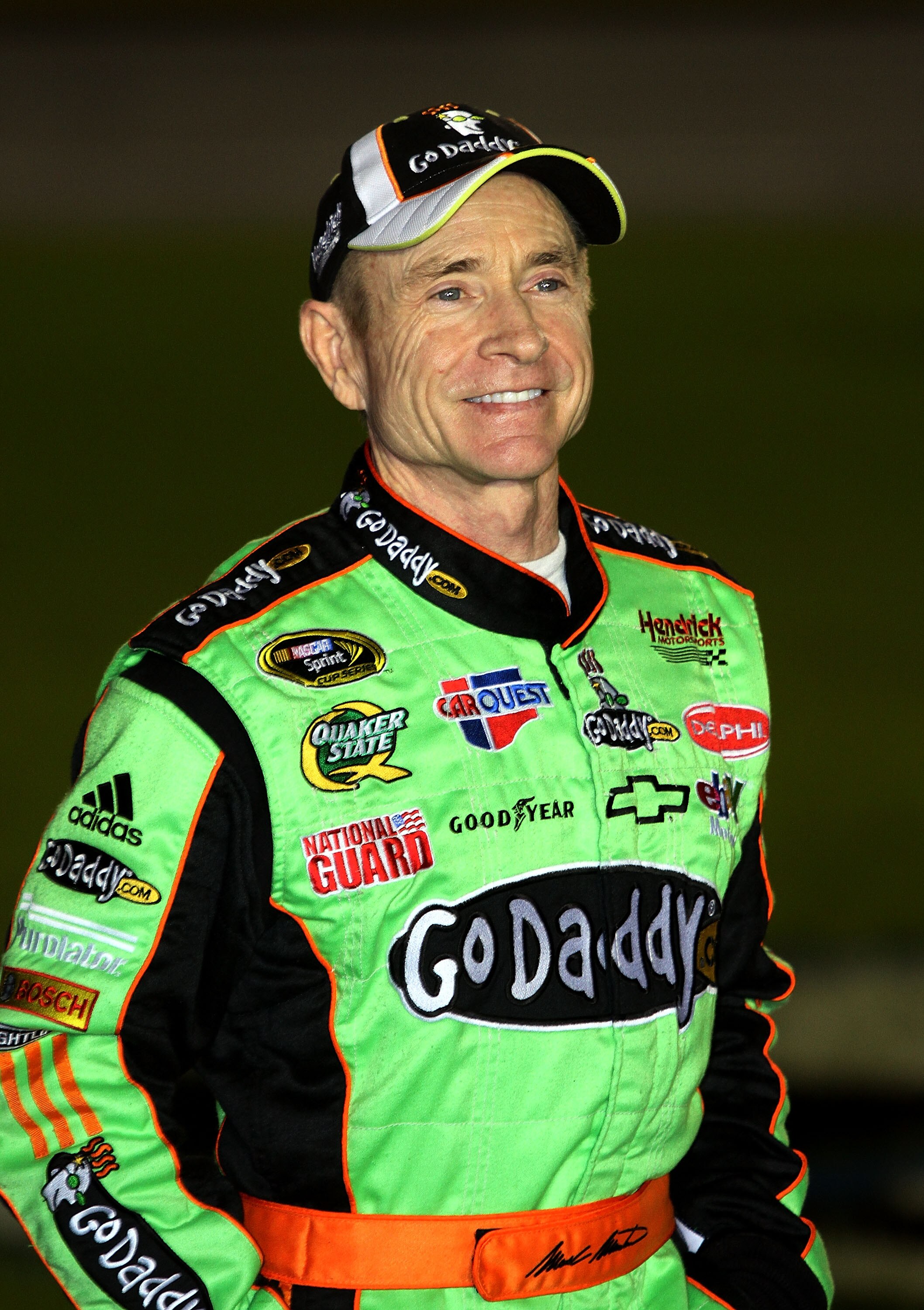 CONCORD, NC - OCTOBER 14:  Mark Martin, driver of the #5 GoDaddy.com Chevrolet, stands on the grid during qualifying for the NASCAR Sprint Cup Series Bank of America 500 at Charlotte Motor Speedway on October 14, 2010 in Concord, North Carolina.  (Photo b