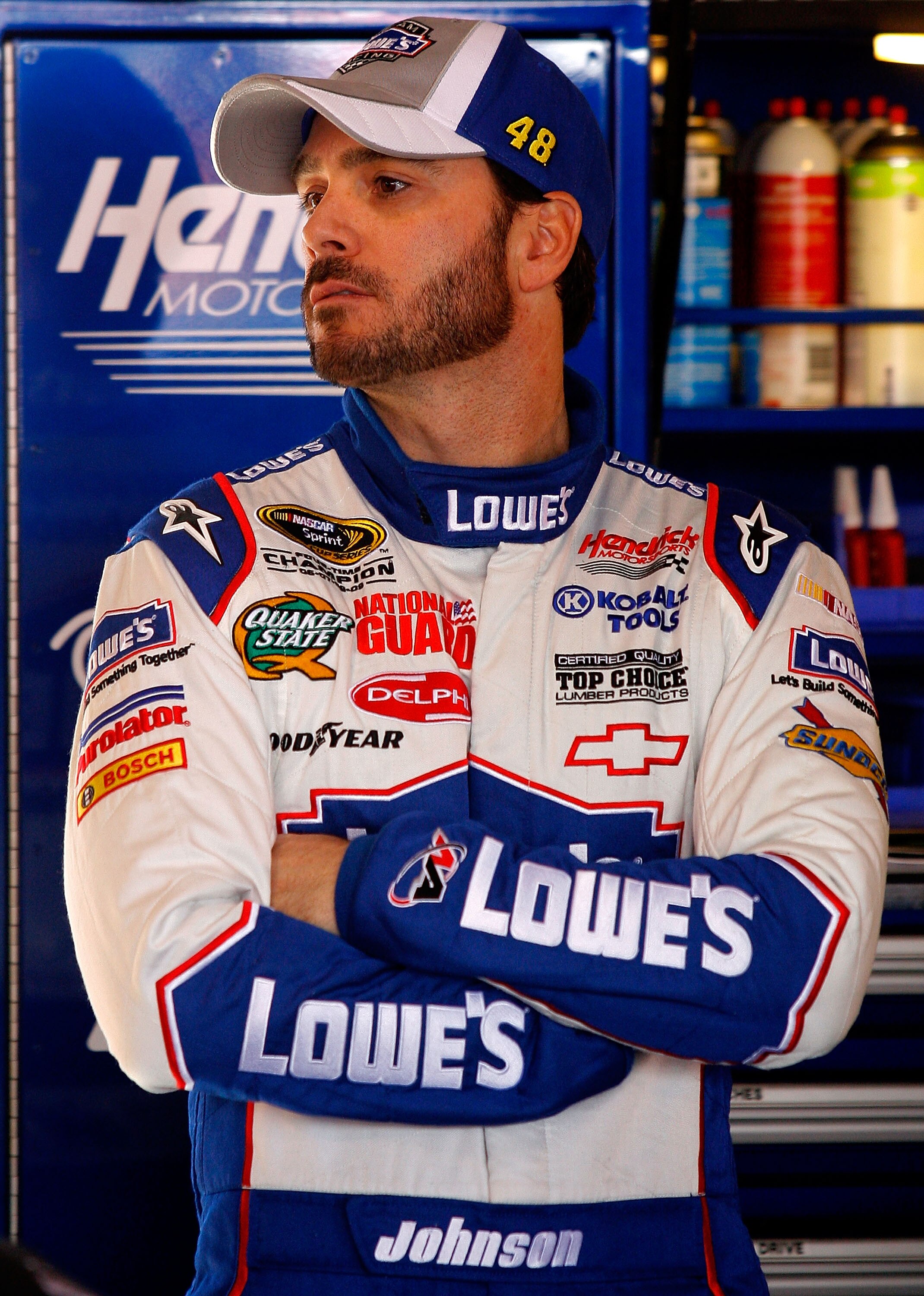 MARTINSVILLE, VA - MARCH 27:  Jimmie Johnson, driver of the #48 Lowe's Chevrolet, stands in the garage during practice for the NASCAR Sprint Cup Series Goody's Fast Pain Relief 500 at Martinsville Speedway on March 27, 2010 in Martinsville, Virginia.  (Ph