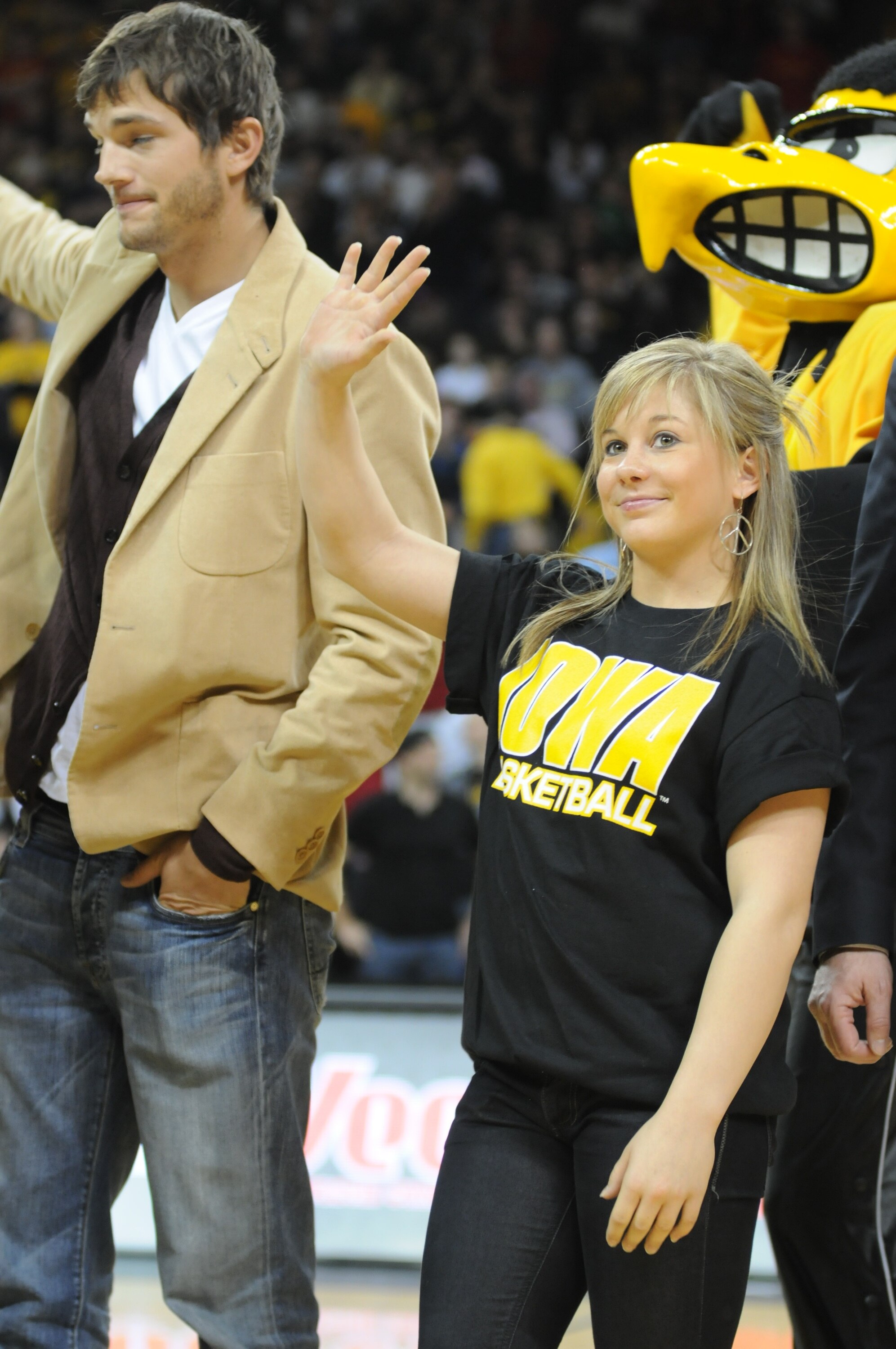 IOWA CITY, IA - DECEMBER 12: Olympic medalist Shawn Johnson (R) and actor Ashton Kutcher are honored during halftime of the Iowa-Iowa State college basketball game on December 12, 2008 at the University of Iowa in Iowa City, Iowa. Johnson and Kutcher, bot