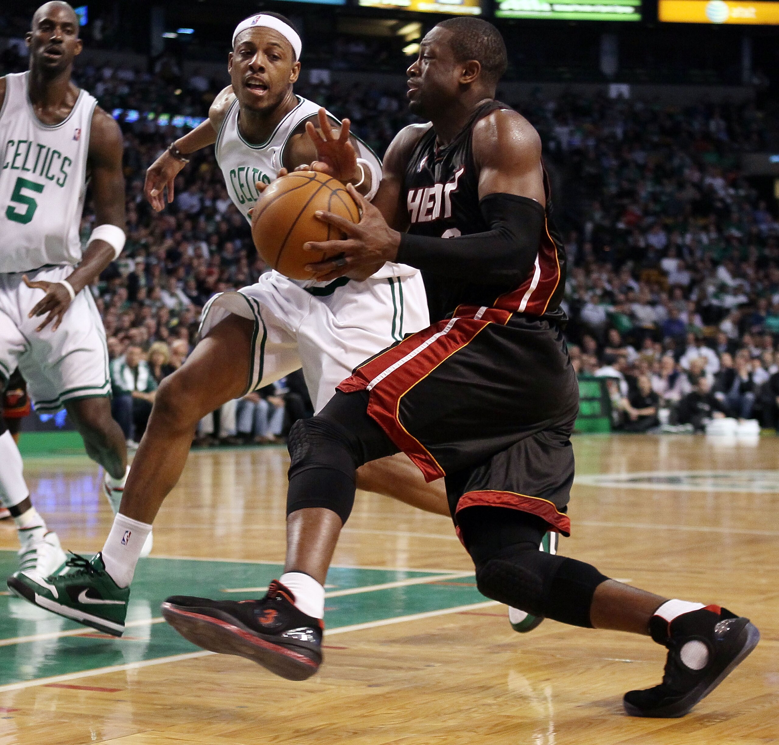 BOSTON - APRIL 27:  Dwyane Wade #3 of the Miami Heat heads for the net as Paul Pierce #34 of the Boston Celtics defends during Game Five of the Eastern Conference Quarterfinals of the 2010 NBA playoffs at the TD Garden on April 27, 2010 in Boston, Massach