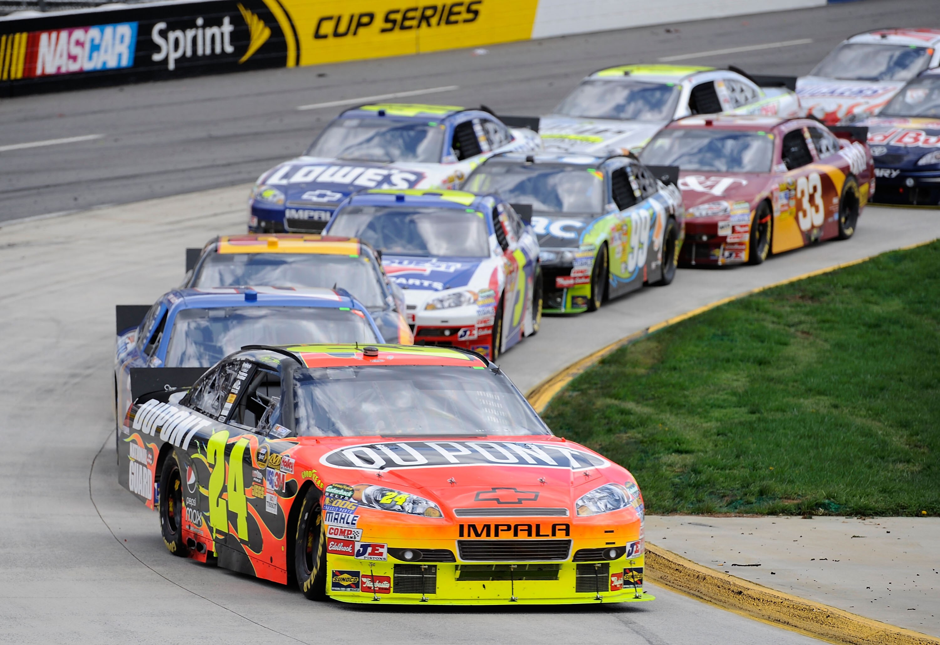 MARTINSVILLE, VA - MARCH 29:  Jeff Gordon leads the field in the #24 Dupont Chevrolet during the NASCAR Sprint Cup Series Goody's Fast Pain Relief 500 at Martinsville Speedway on March 29, 2010 in Martinsville, Virginia.  (Photo by John Harrelson/Getty Im