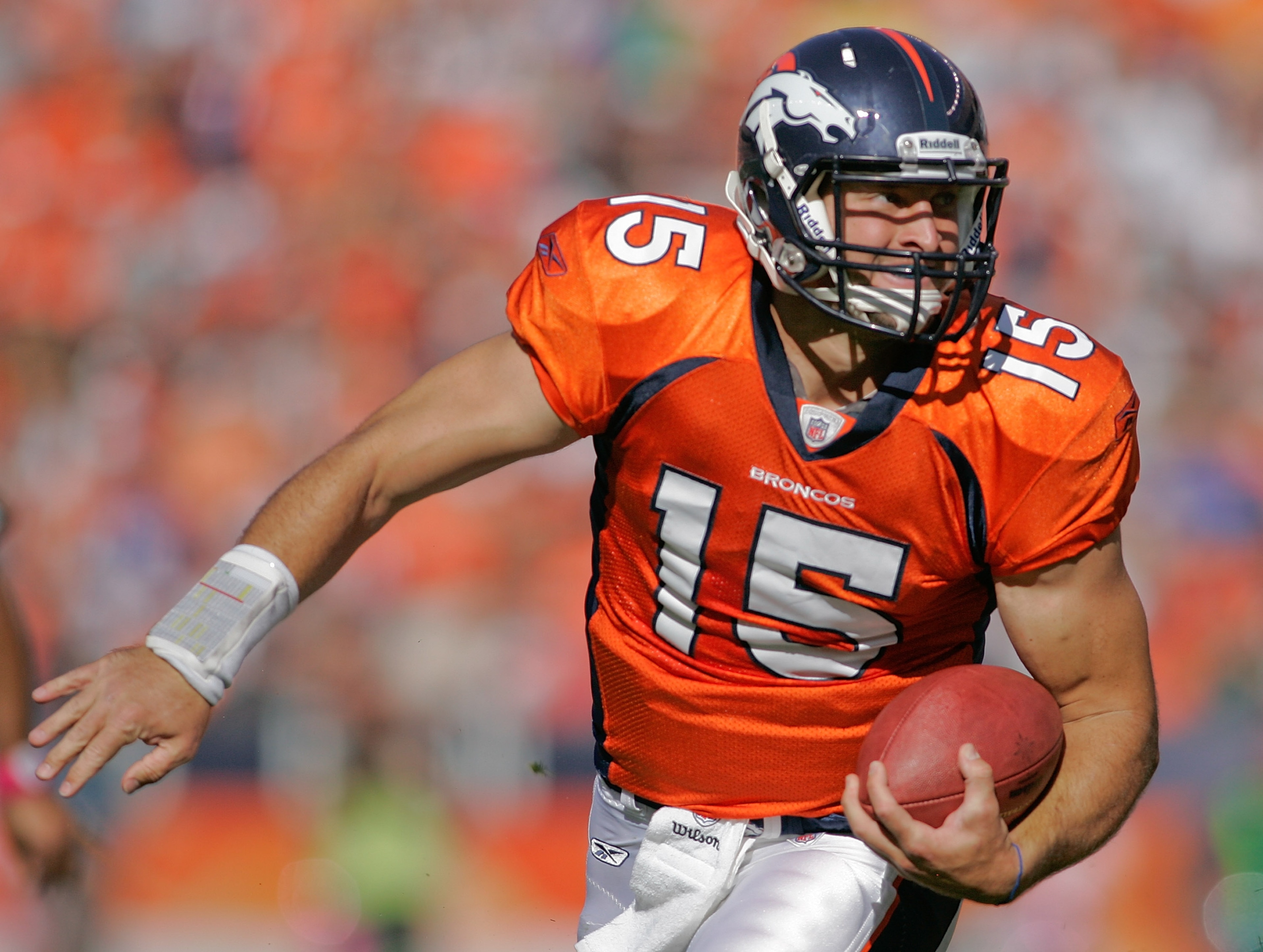DENVER - OCTOBER 17:  Quarterback Tim Tebow #15 of the Denver Broncos runs for a touchdown against the New York Jets at INVESCO Field at Mile High on October 17, 2010 in Denver, Colorado.  (Photo by Justin Edmonds/Getty Images)