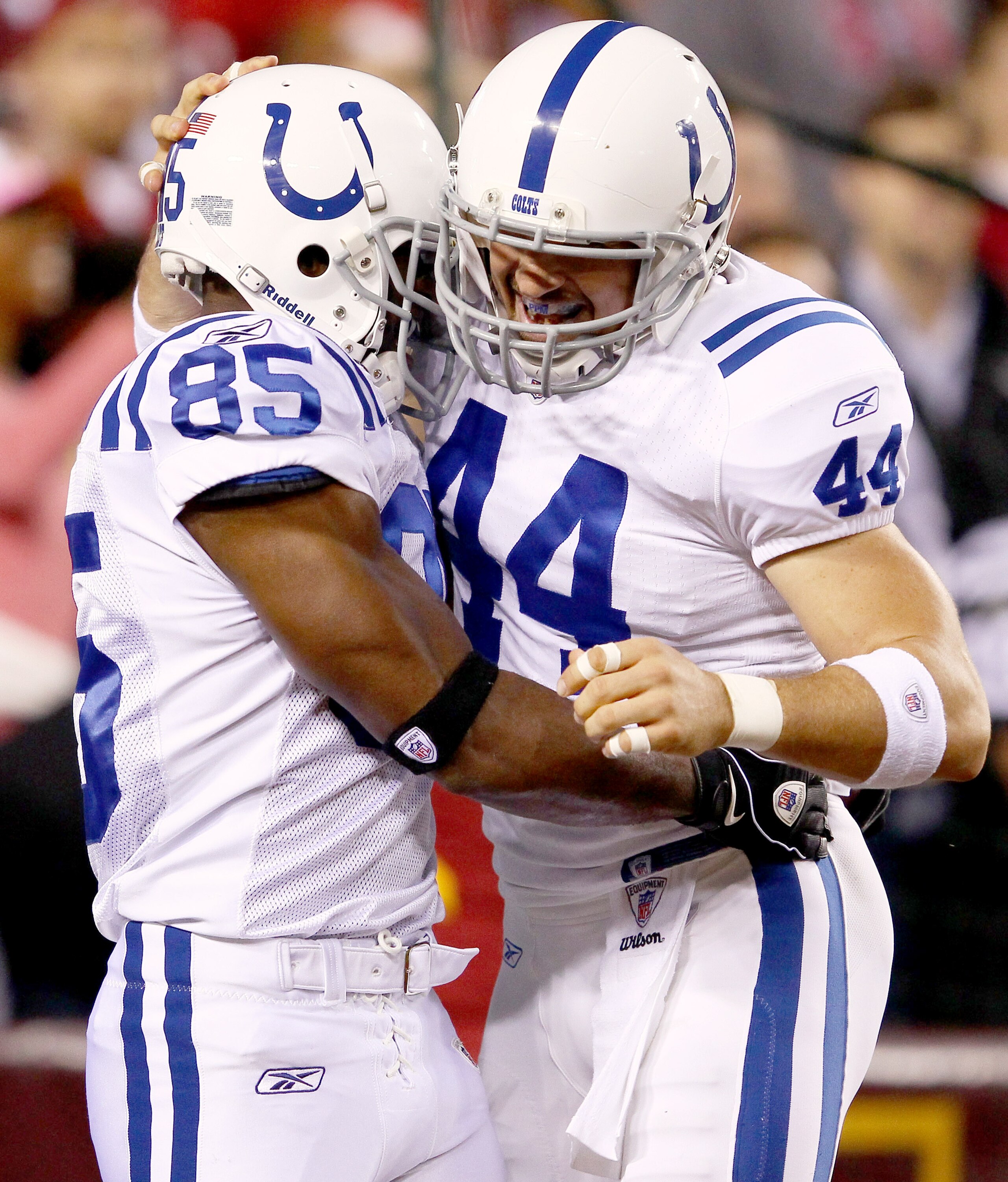 LANDOVER, MD - OCTOBER 17:  Reggie Wayne #85 celebrates scoring a touchdown with teammate Dallas Clark #44 the Indianapolis Colts against the Washington Redskins at FedExField on October 17, 2010 in Landover, Maryland.  (Photo by Win McNamee/Getty Images)