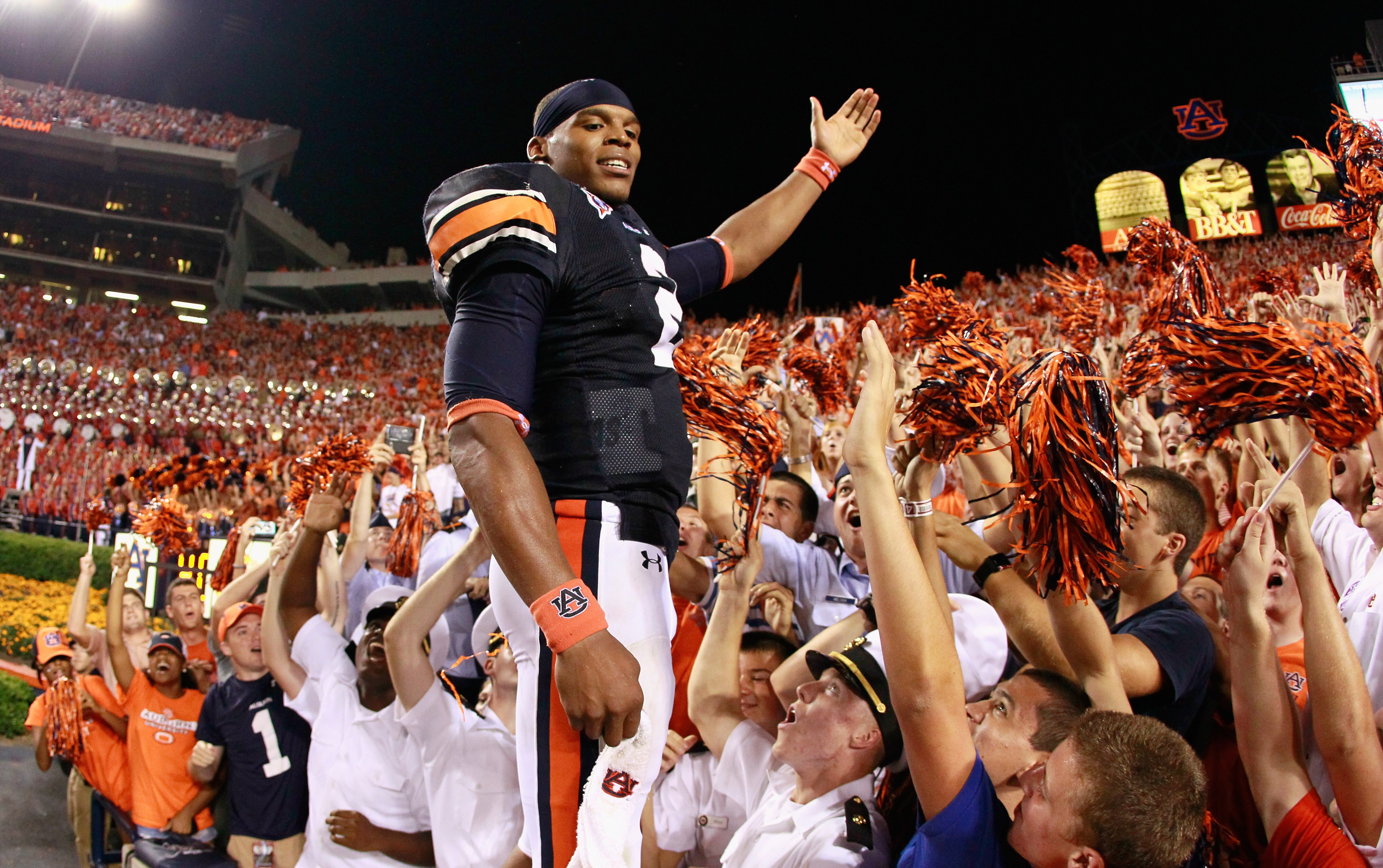 AUBURN, AL - SEPTEMBER 25:  Quarterback Cameron Newton #2 of the Auburn Tigers celebrates in the stands after their 35-27 win over the South Carolina Gamecocks at Jordan-Hare Stadium on September 25, 2010 in Auburn, Alabama.  (Photo by Kevin C. Cox/Getty