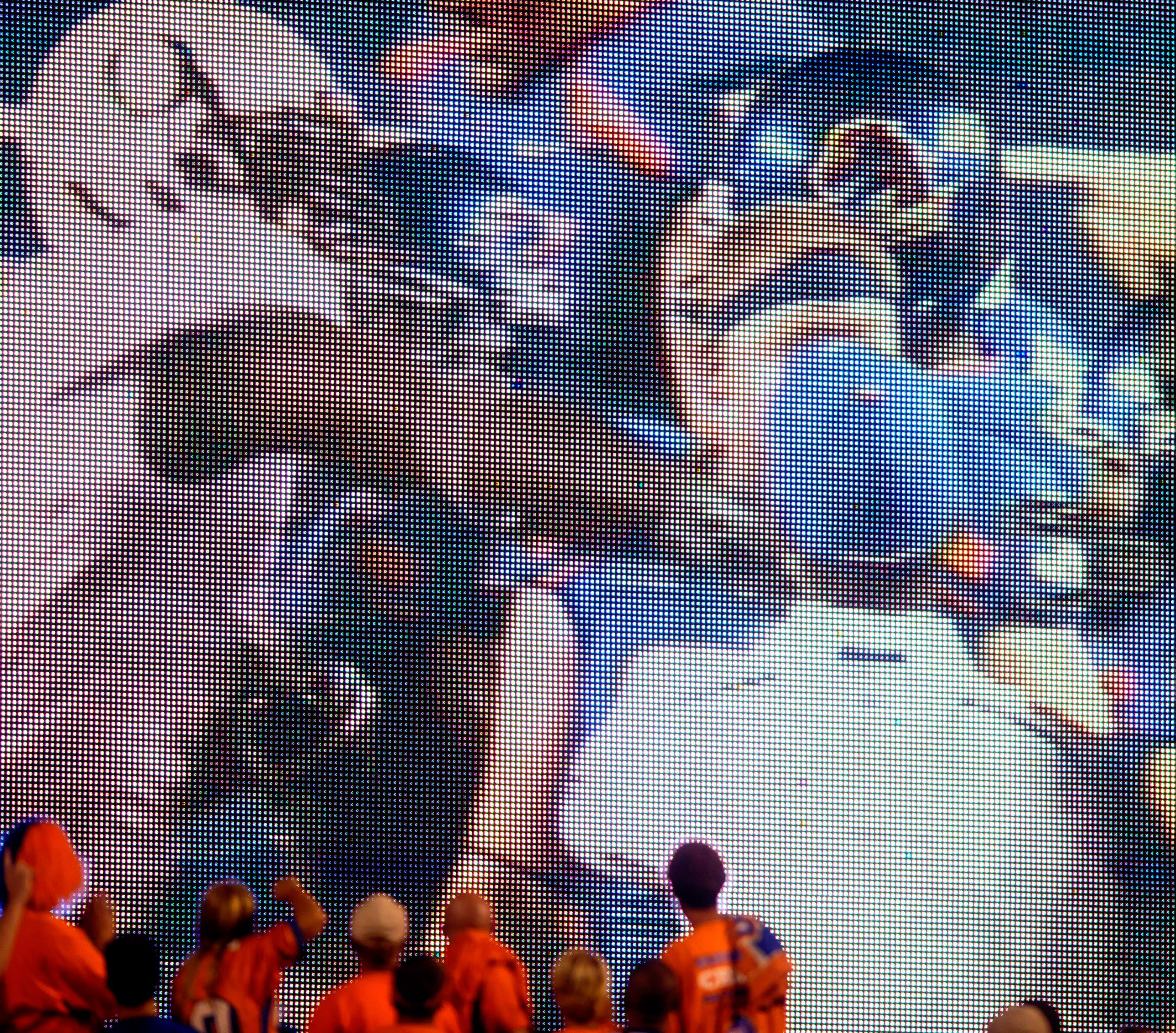 BOISE, ID - SEPTEMBER 3:  Boise State fans watch the video board as LaGarrette Blount #9 of the Oregon Ducks is shown punching a Boise State Broncos player after the game causing quite a commotion and talk of him being arrested on September 3, 2009 at Bro