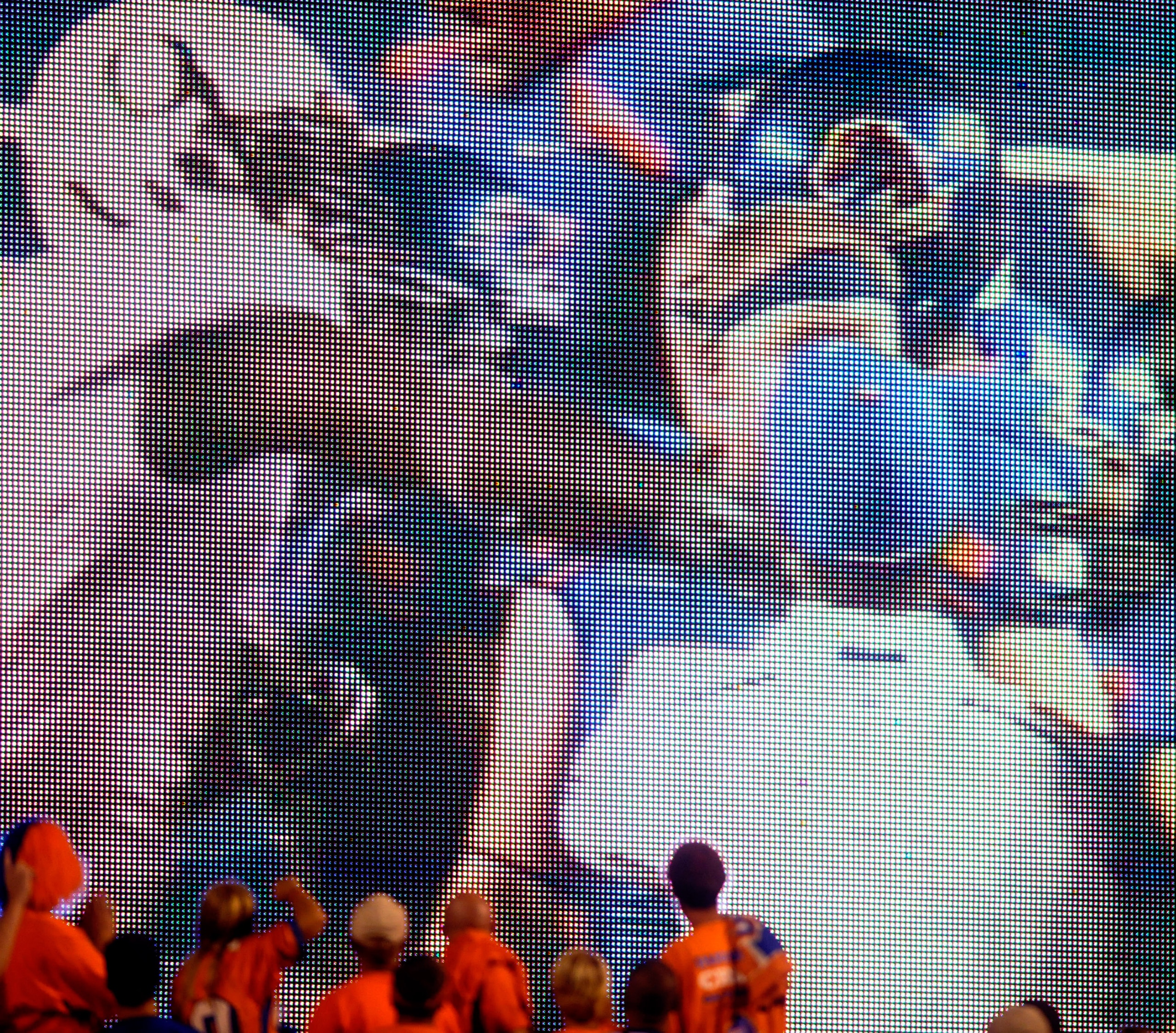 BOISE, ID - SEPTEMBER 3:  Boise State fans watch the video board as LaGarrette Blount #9 of the Oregon Ducks is shown punching a Boise State Broncos player after the game causing quite a commotion and talk of him being arrested on September 3, 2009 at Bro