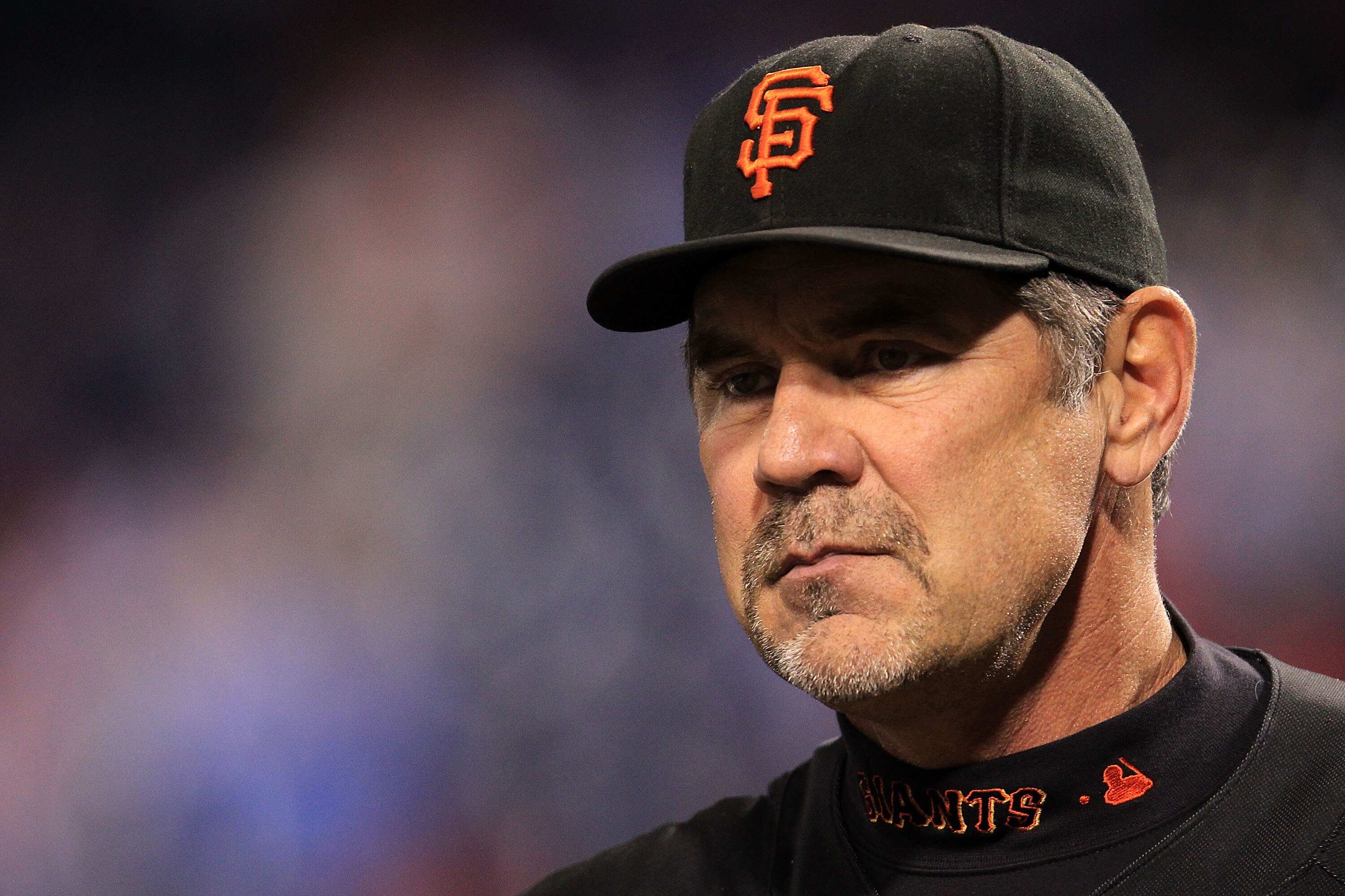 PHILADELPHIA - OCTOBER 17:  Manager Bruce Bochy of the San Francisco Giants looks on during batting practice before taking on the Philadelphia Phillies in Game Two of the NLCS during the 2010 MLB Playoffs at Citizens Bank Park on October 17, 2010 in Phila