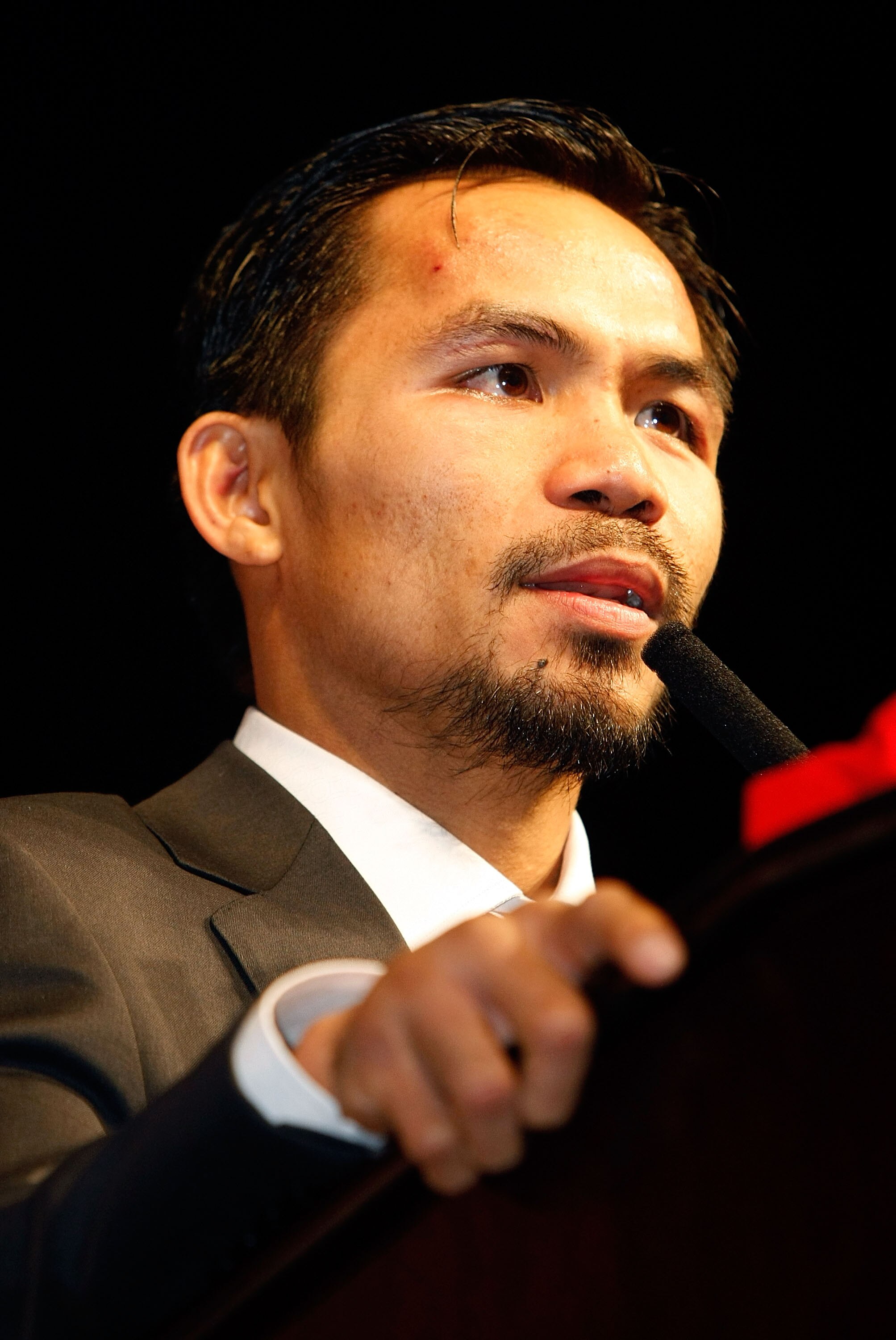LAS VEGAS - DECEMBER 06:  Manny Pacquiao of the Philippines speaks at a news conference following his win over Oscar De La Hoya after their welterweight fight at the MGM Grand Garden Arena December 6, 2008 in Las Vegas, Nevada.  (Photo by Ethan Miller/Get