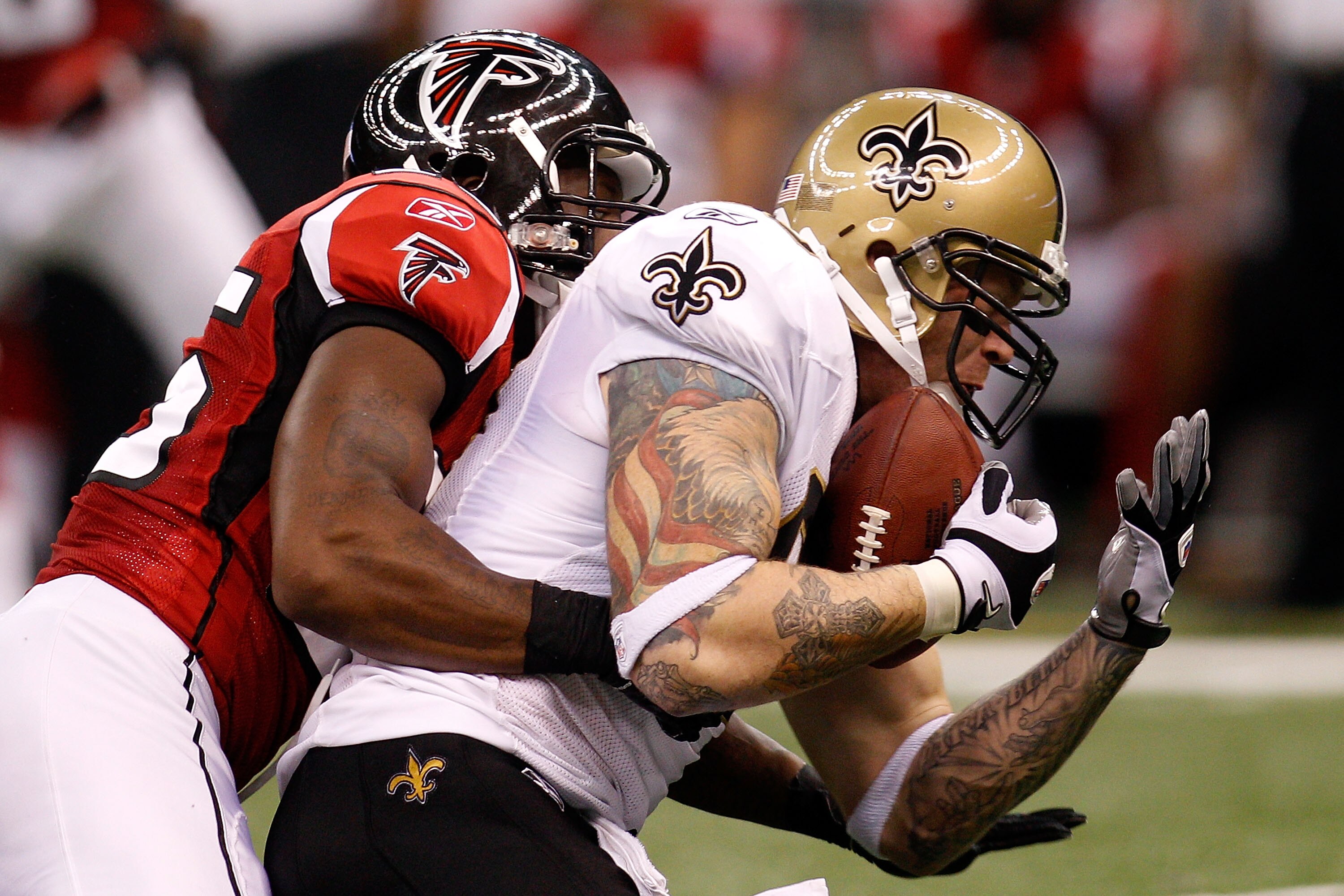 NEW ORLEANS - SEPTEMBER 26:  Jeremy Shockey #88 of the New Orleans Saints is tackled by William Moore #25 of the Atlanta Falcons at the Louisiana Superdome on September 26, 2010 in New Orleans, Louisiana.  (Photo by Chris Graythen/Getty Images)