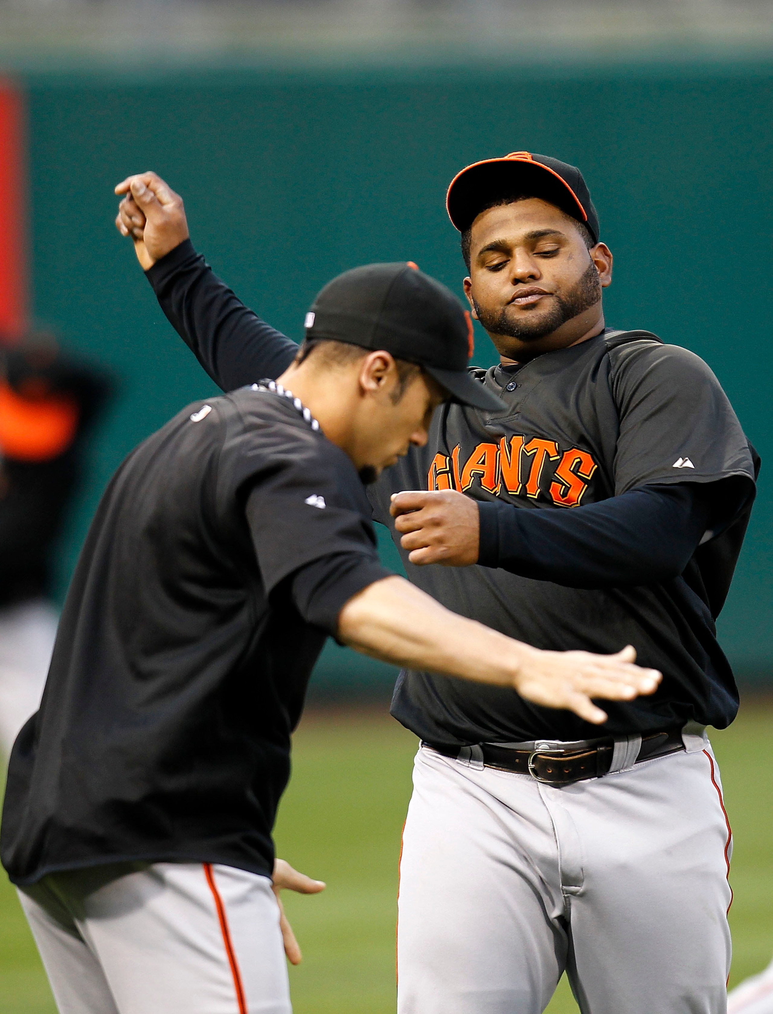 PHILADELPHIA - OCTOBER 15:  Pablo Sandoval #48 and Andres Torres #56 of the San Francisco Giants practice during a workout before the NLCS against the Philadelphia Phillies at Citizens Bank Park on October 15, 2010 in Philadelphia, Pennsylvania.  (Photo b