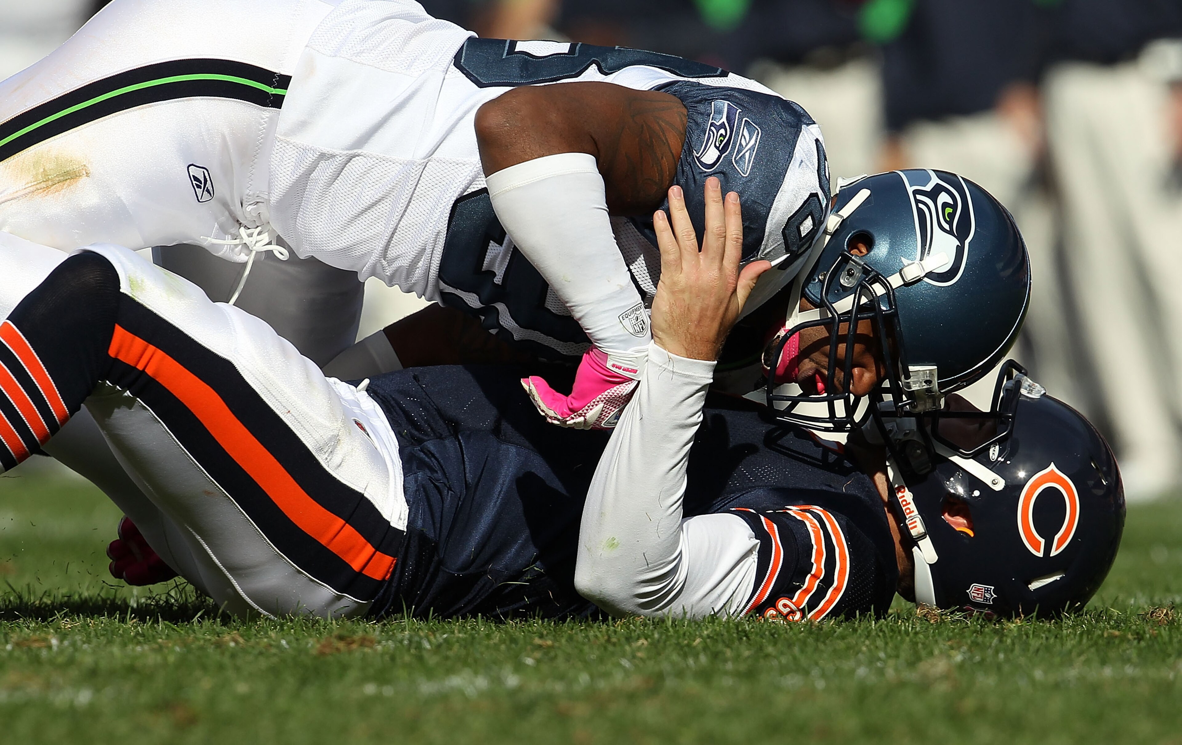 CHICAGO - OCTOBER 17: Jay Cutler #6 of the Chicago Bears is driven to the ground after throwing by Raheem Brock #98 of the Seattle Seahawks at Soldier Field on October 17, 2010 in Chicago, Illinois. The Seahawks defeated the Bears 23-20. (Photo by Jonatha