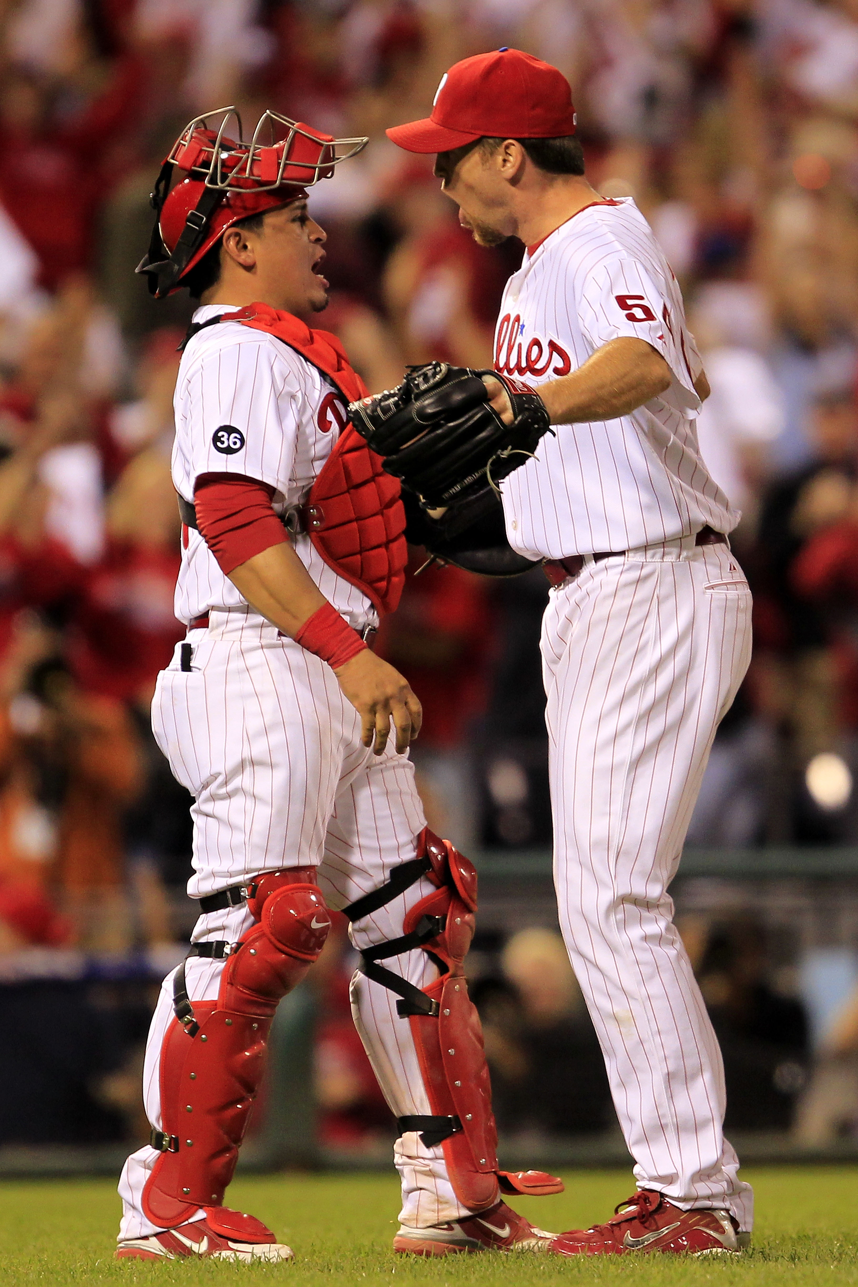 PHILADELPHIA - OCTOBER 08:  Carlos Ruiz #51 (L) and Brad Lidge #54 of the Philadelphia Phillies celebrate victory over the Cincinnati Reds in game 2 of NLDS at Citizens Bank Park on October 8, 2010 in Philadelphia, Pennsylvania. The Phillies defeated the